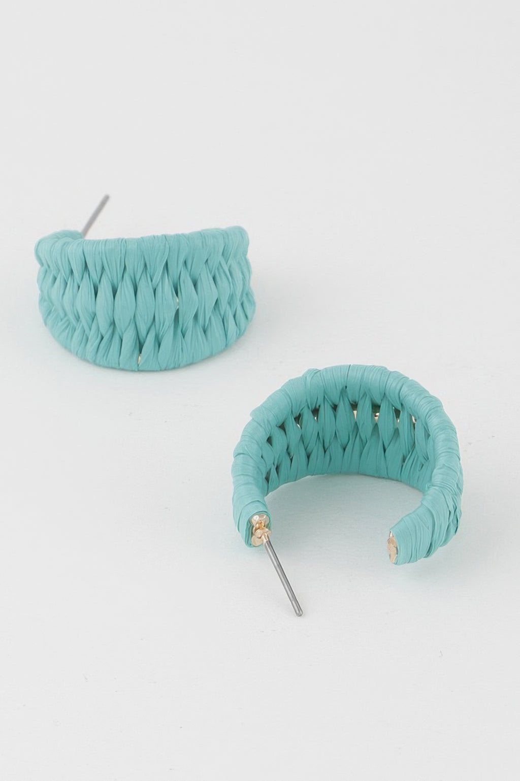 Turquoise triple-woven hoop earrings viewed from front, curved crescent with metal posts