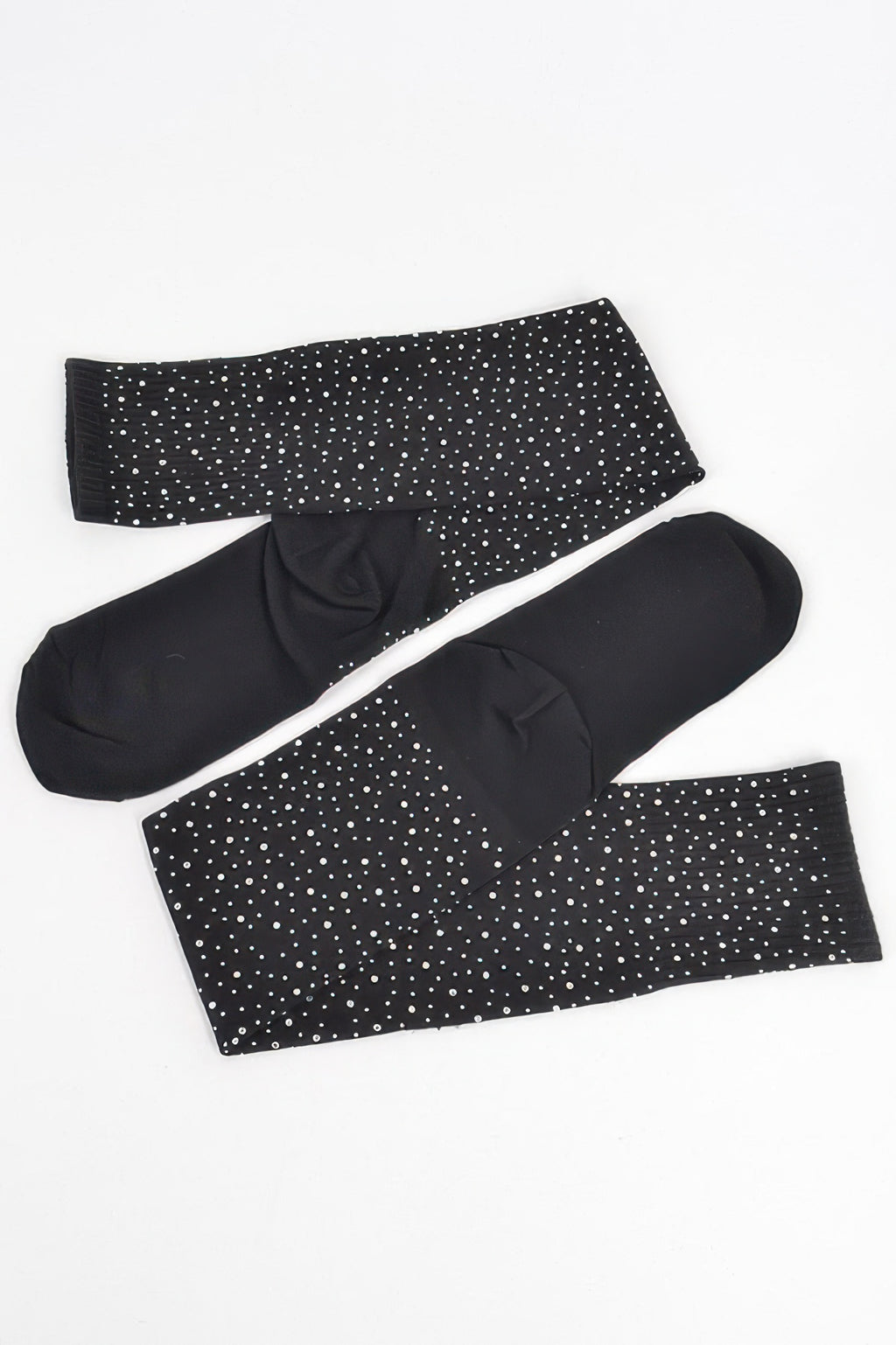 Stone knee-high socks in black, laid flat; scattered rhinestone dot pattern