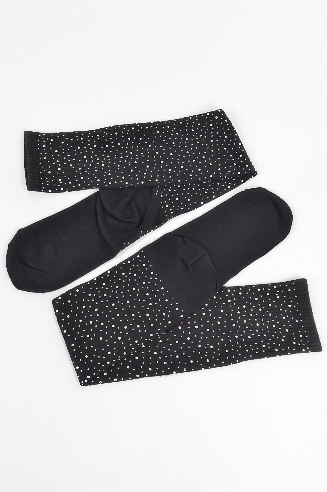 Stone knee-high socks in black, laid flat; scattered rhinestone dot pattern