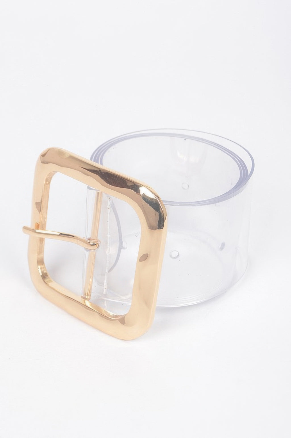 Transparent belt buckle close-up with gold square frame
