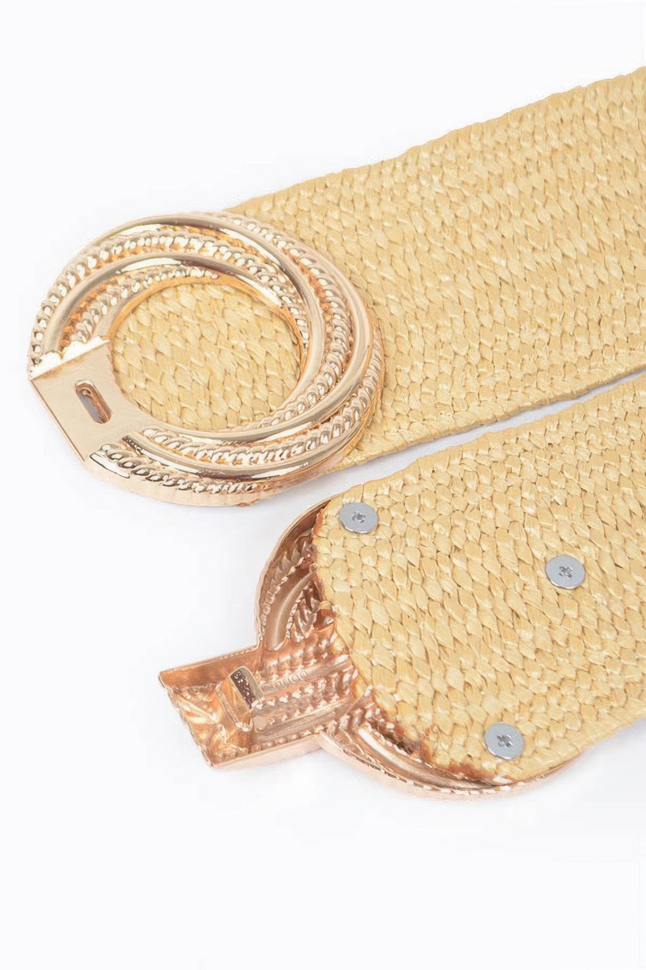 Close-up of khaki belt buckle and perforated textured strap with snap stud hardware