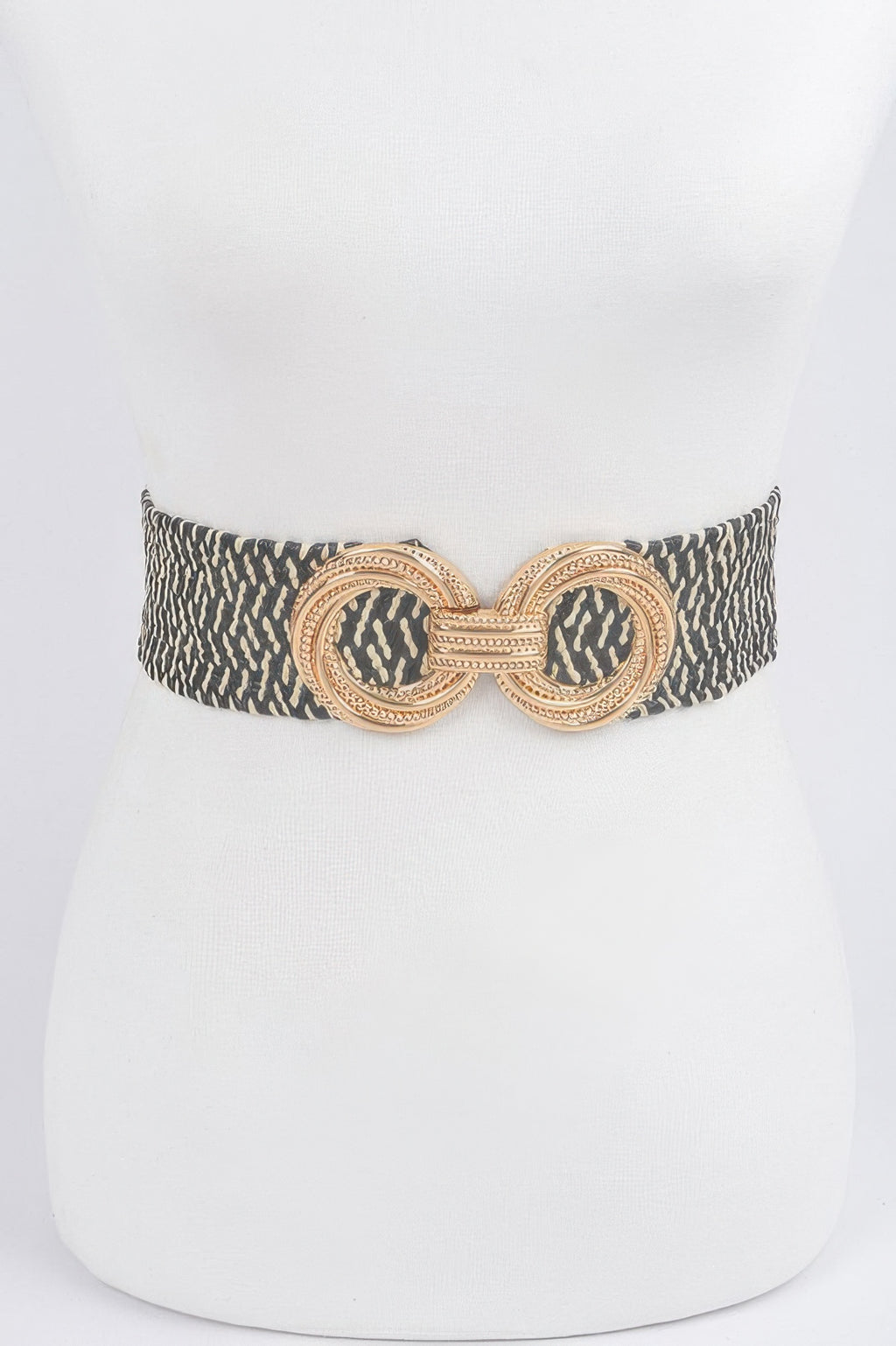 Dark patterned stretch waist belt with ornate round metal buckle and linked center design