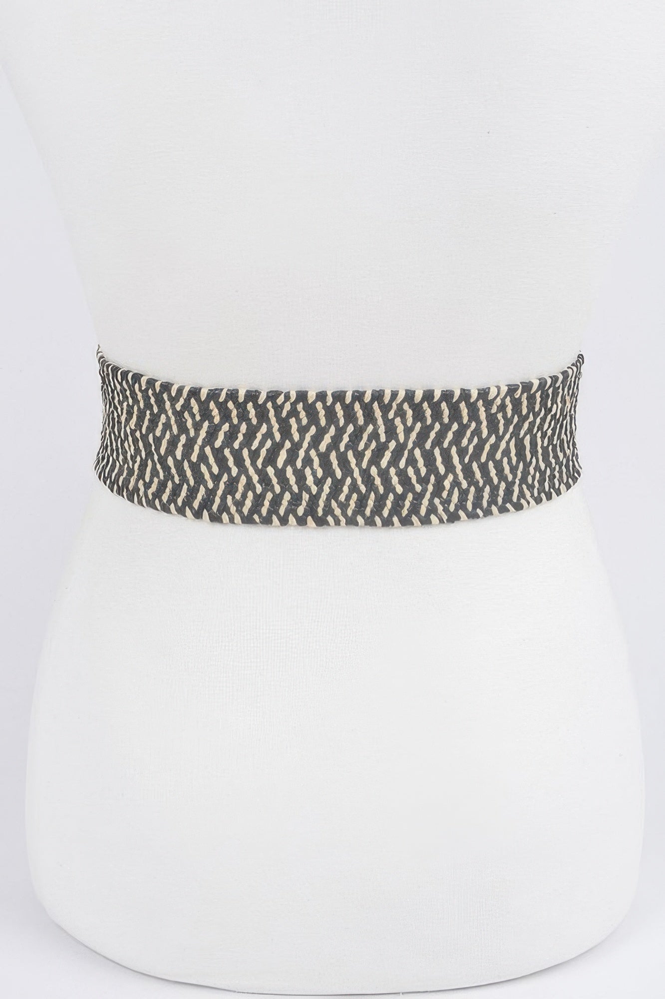Dark patterned stretch waist belt band with textured woven fabric, buckle not visible