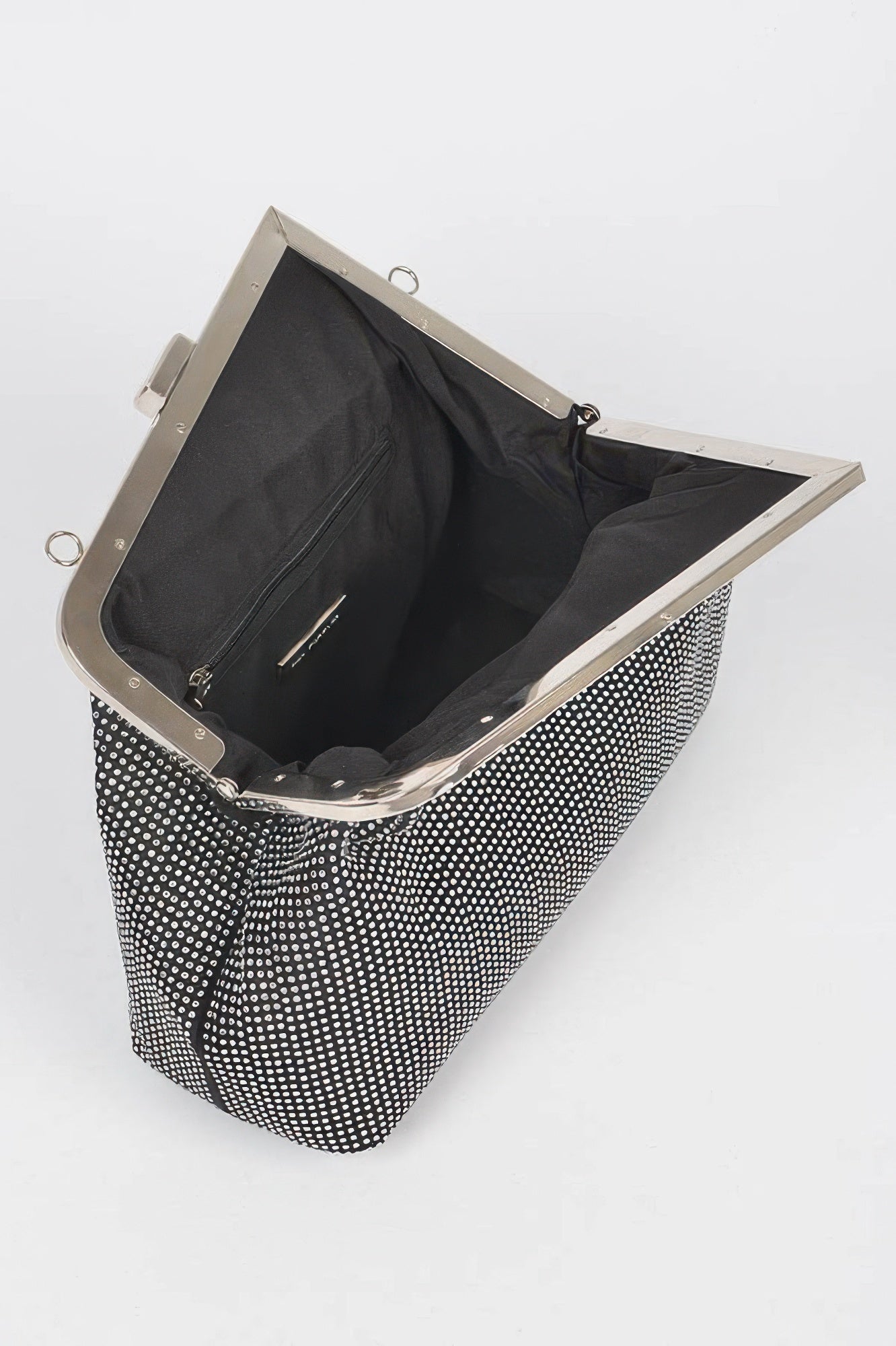 Black rhinestone frame clutch open, shows black satin lining and inner zip pocket