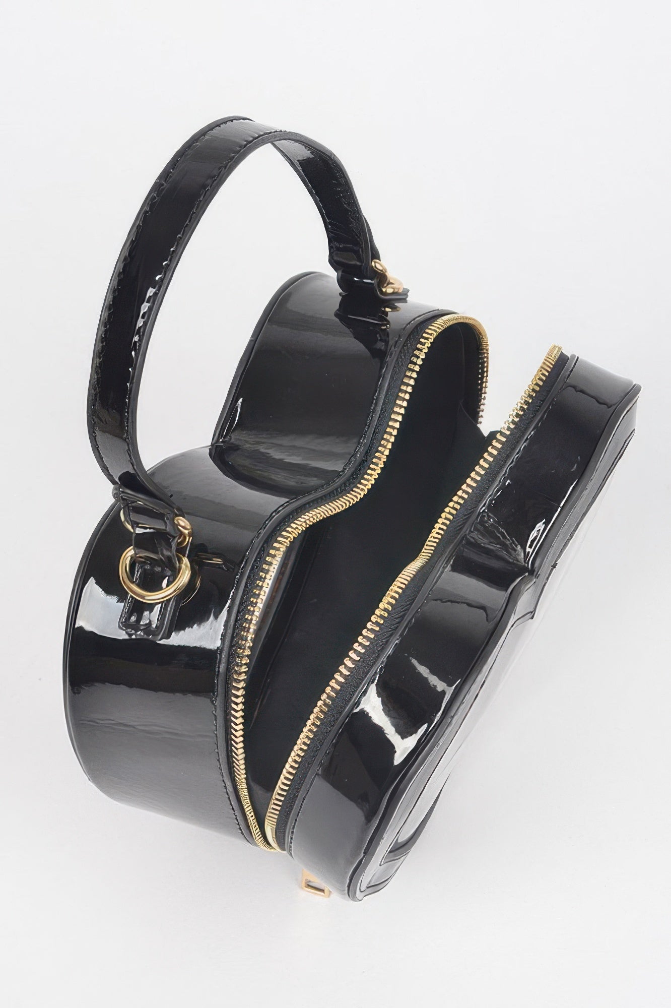 Black glossy heart crossbody bag, transparent front panel, gold zipper pulls