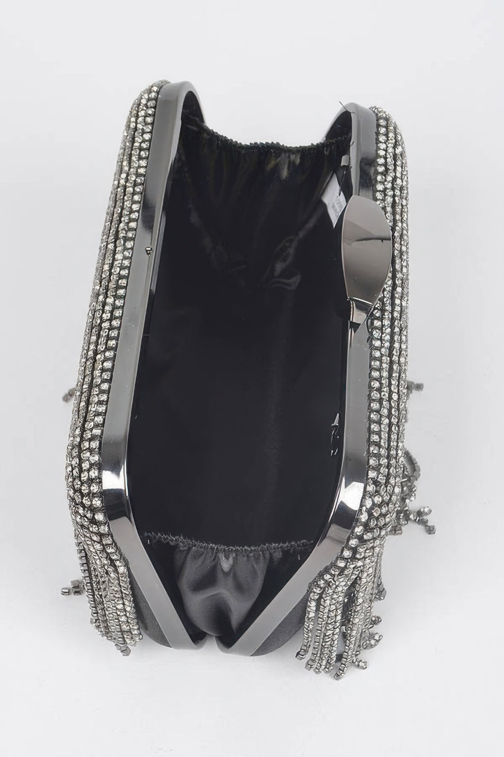 Rhinestone fringe hard clutch interior view, black lining with silver rhinestone trim