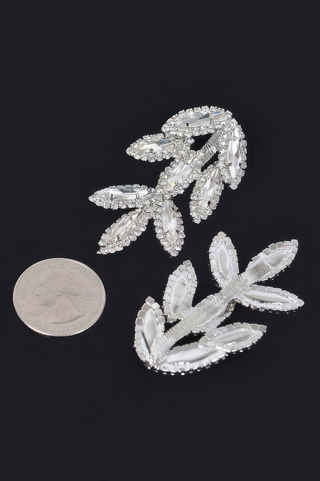 Silver rhinestone leaf earrings with layered curved leaf shapes