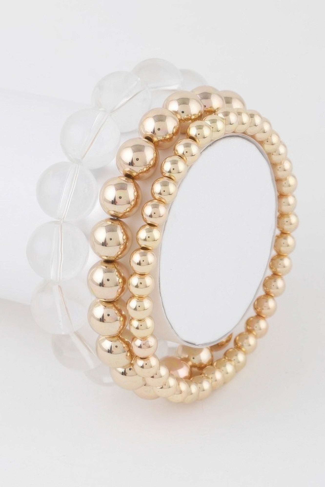 Minimal triple beaded bracelet: gold clear round bead strands, stacked view