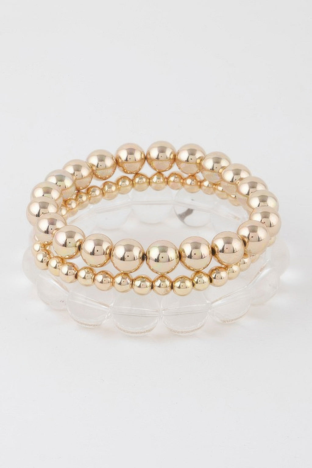 Triple beaded bracelet with two gold clear rows and one inner strand, round beads