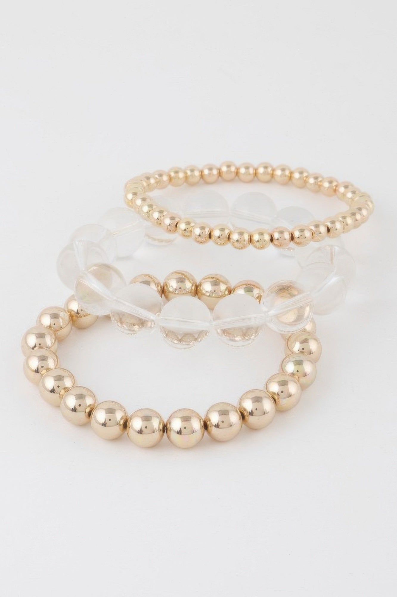 Gold clear triple beaded bracelet set: three rings of round beads, slim fit