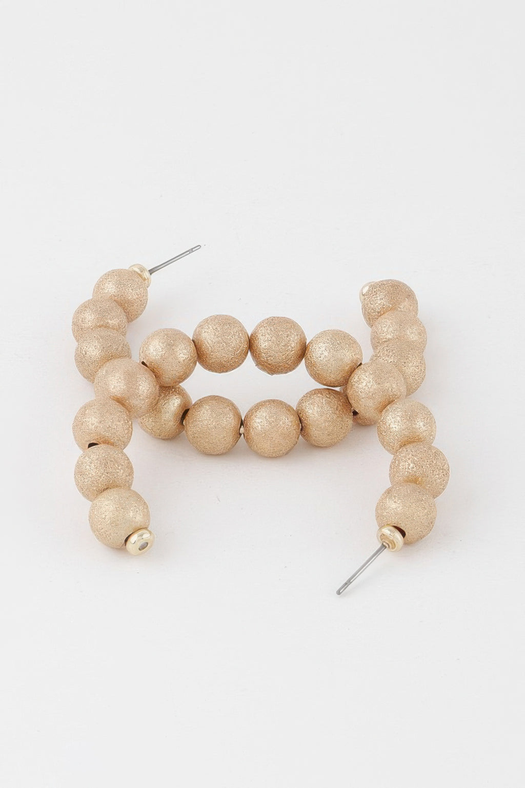 Gold multi beaded hoop earrings with textured ball beads and metal posts