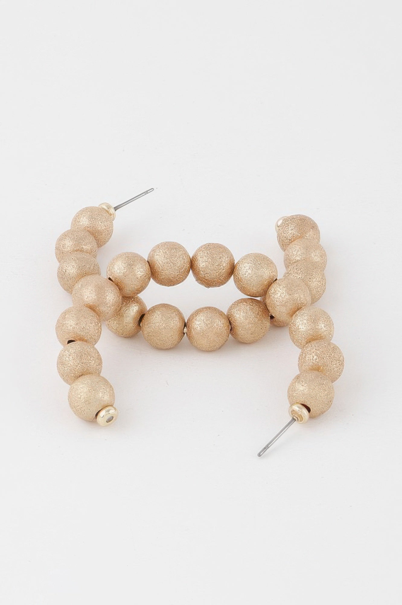 Gold multi beaded hoop earrings with textured ball beads and metal posts