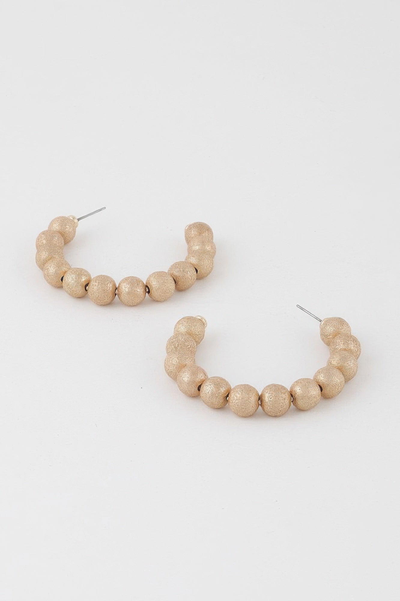 Gold multi beaded hoop earrings, spaced sphere beads around a hoop