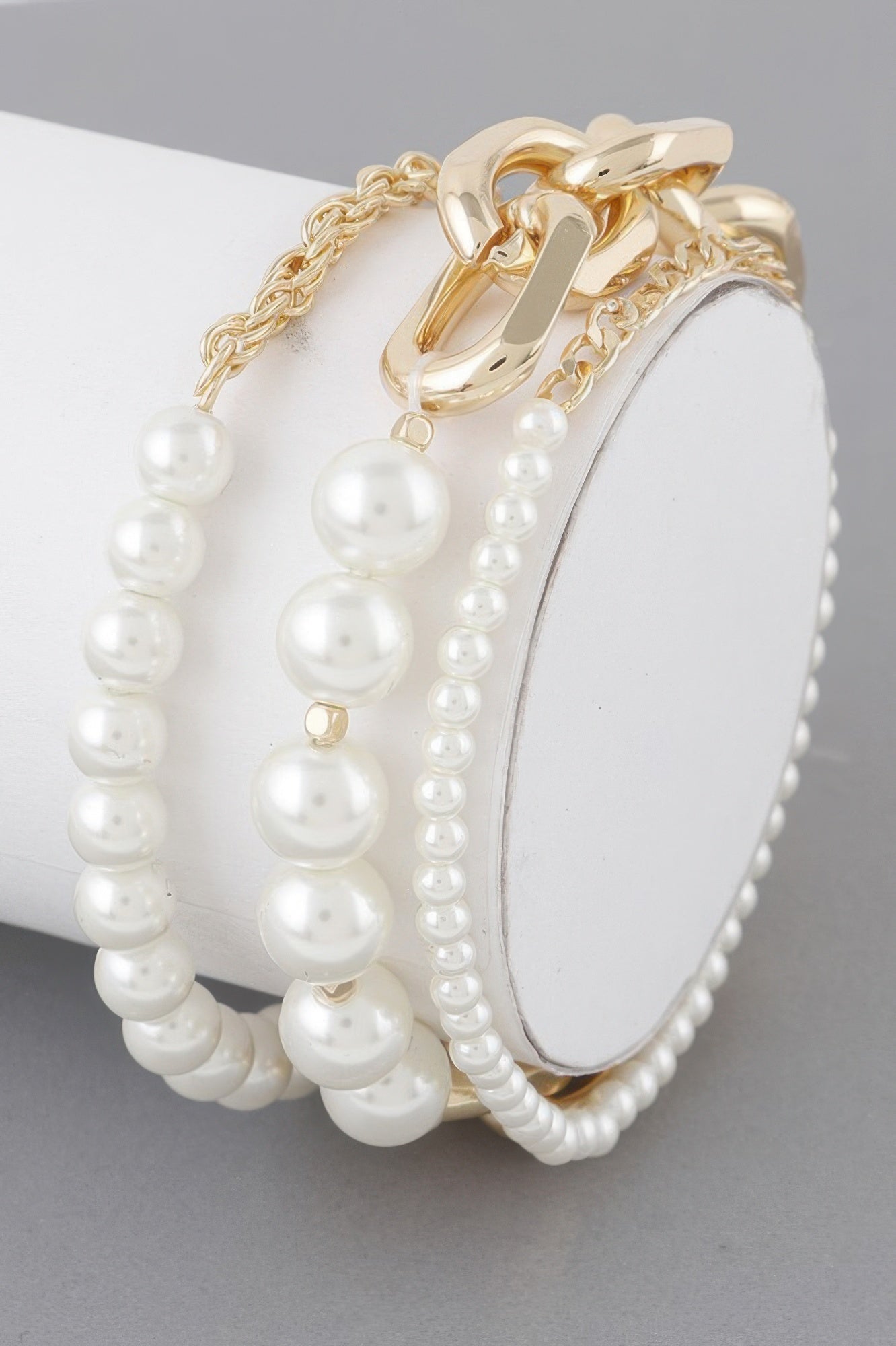 Multi Pearl Chain Bracelet: gold-tone chain with round white pearls and link clasp