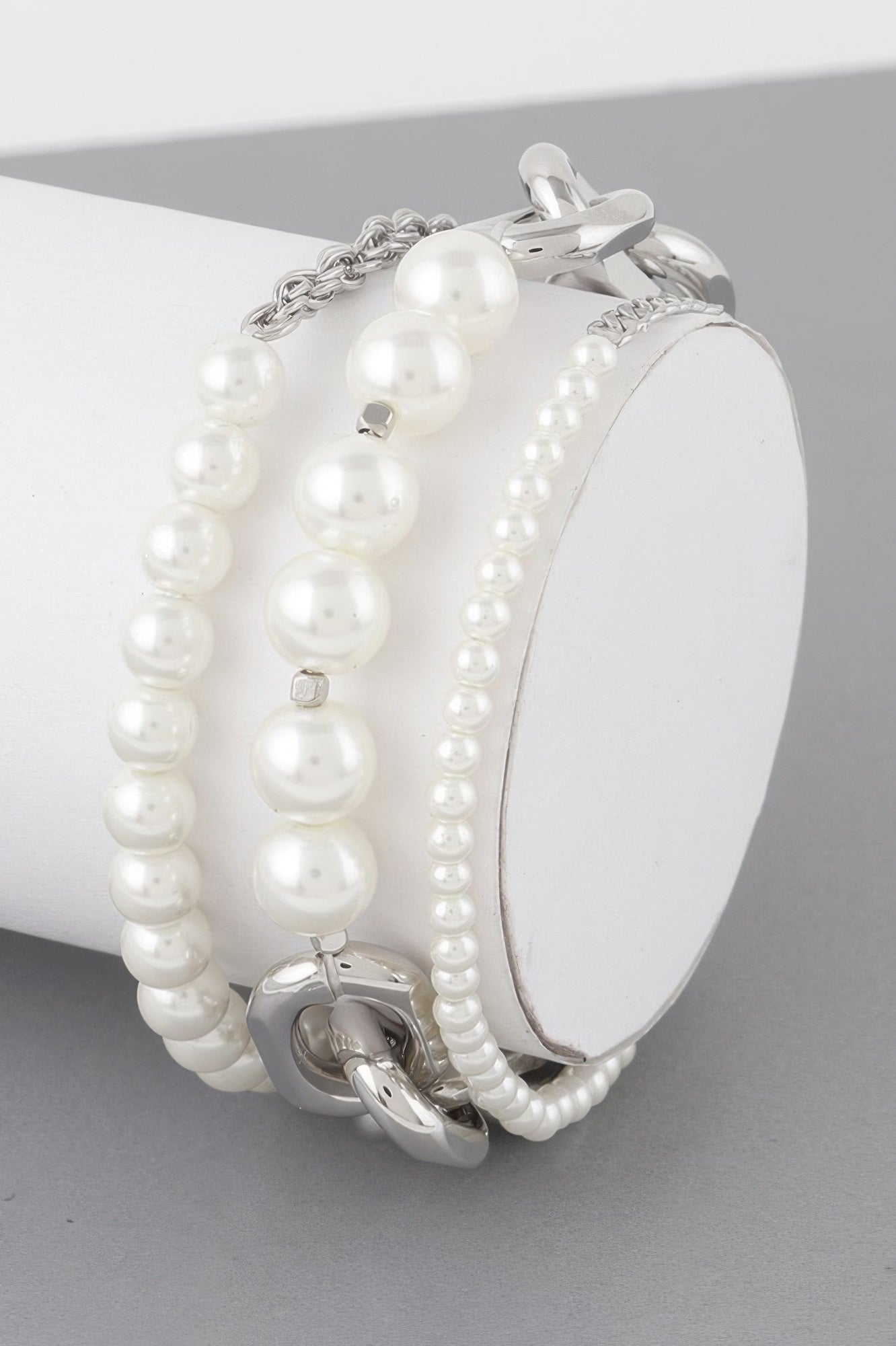 Multi Pearl Chain Bracelet: silver-tone chain with round white pearls and curved clasp