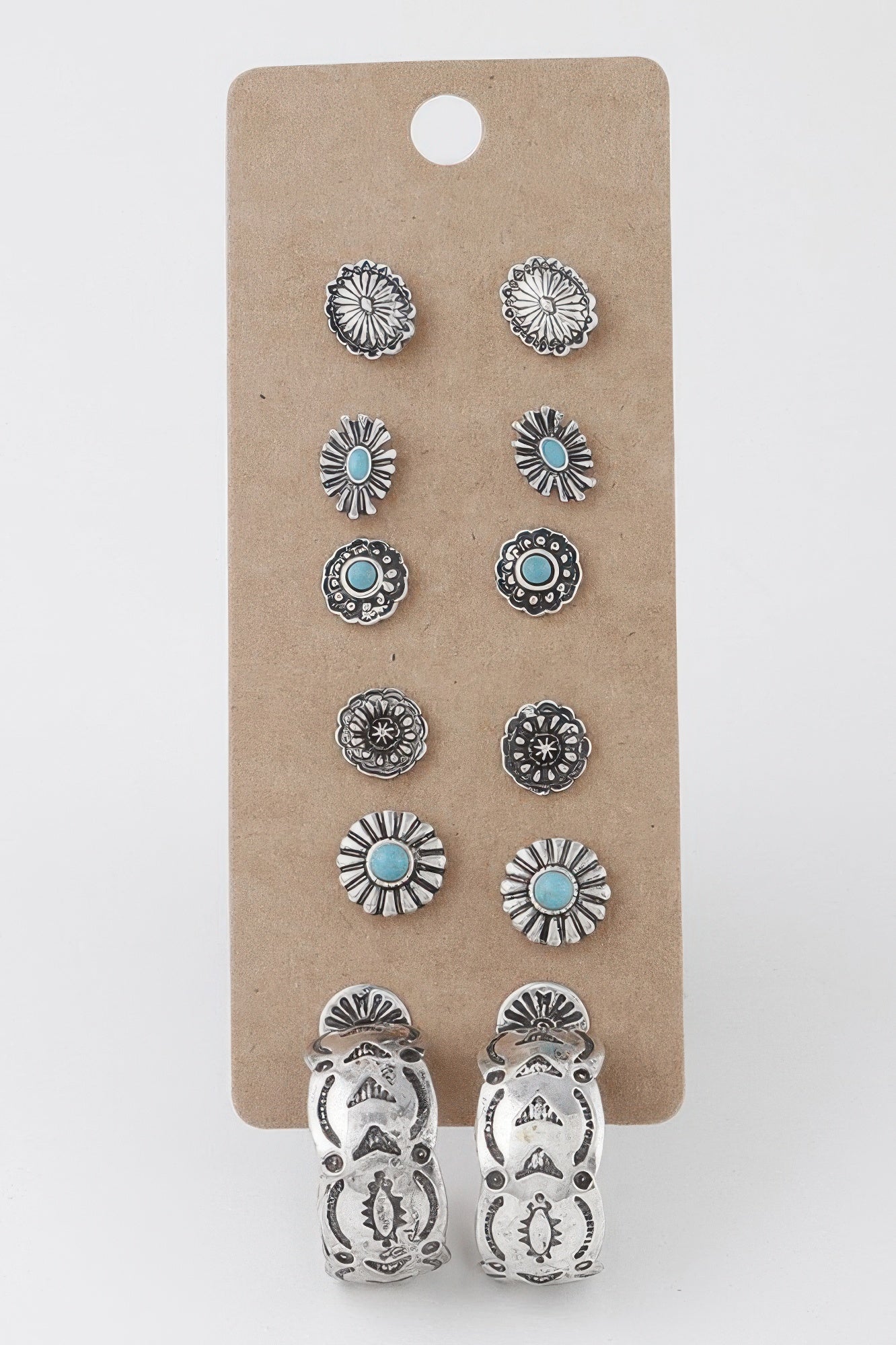Antique sun stud earrings set with turquoise center and silver-toned frames