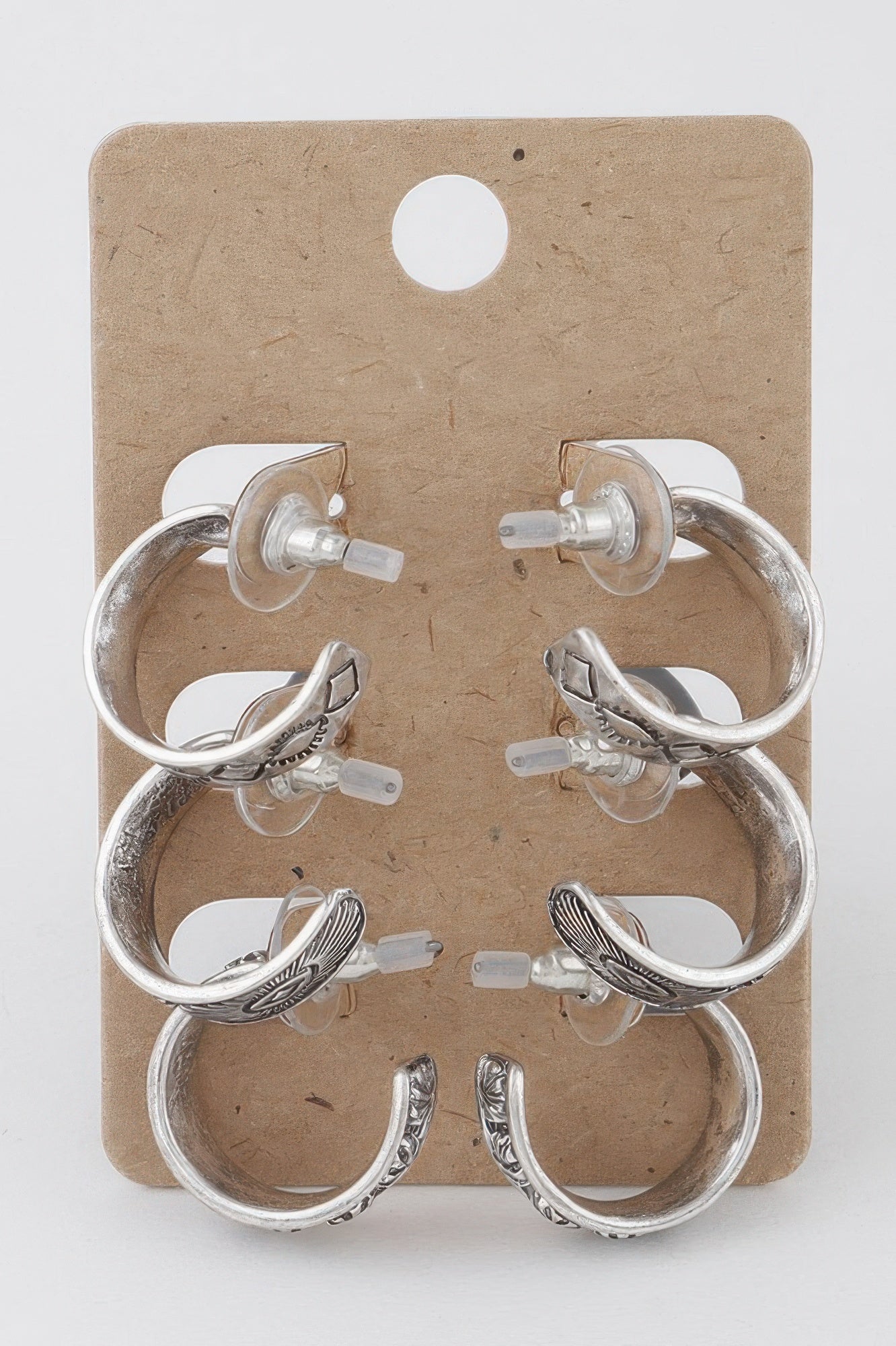 Set of antique silver hoop earrings with several mixed sizes and textured details