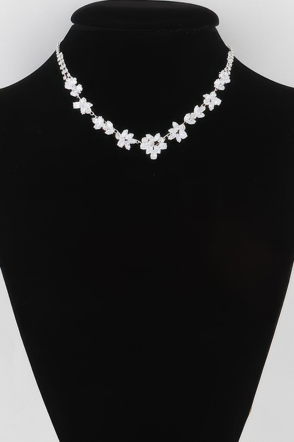 Crystal flower charm necklace with clear stones and silver-tone chain
