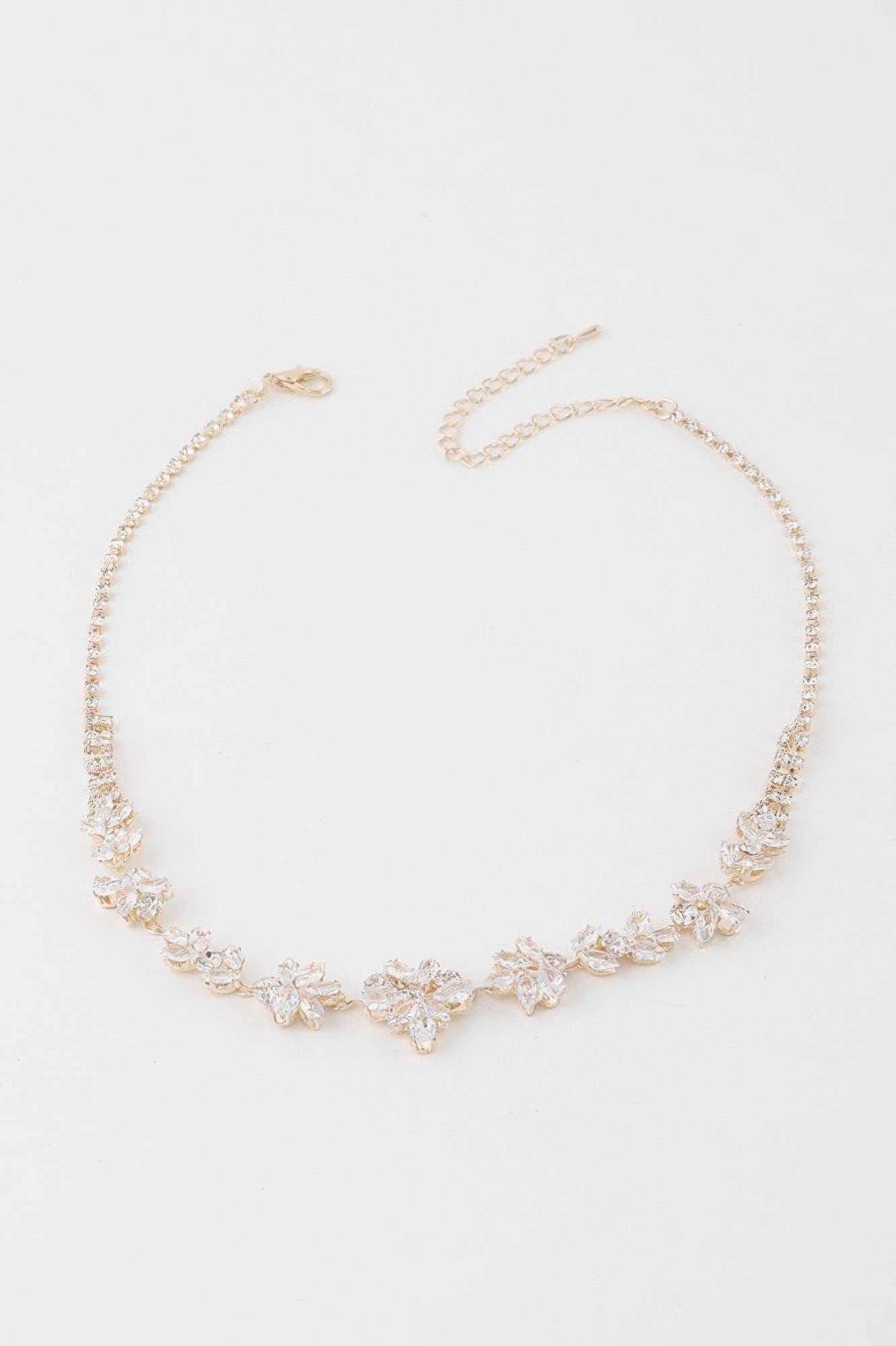 Crystal flower charm necklace with clear stones and gold-tone chain