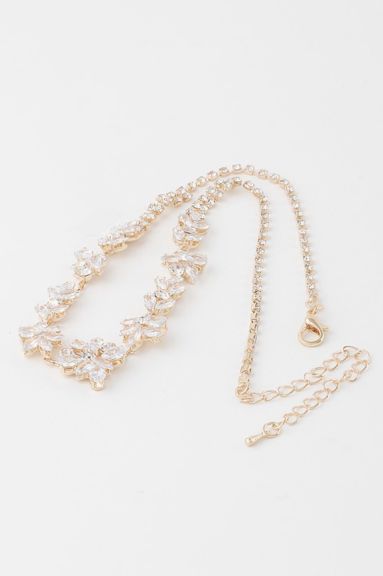 Crystal flower charm necklace, gold-tone clear crystal flower design with clasp