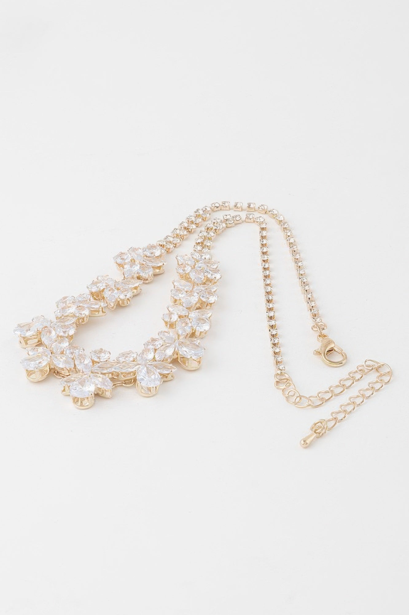Gold crystal flower charm necklace with layered flower rows and lobster clasp