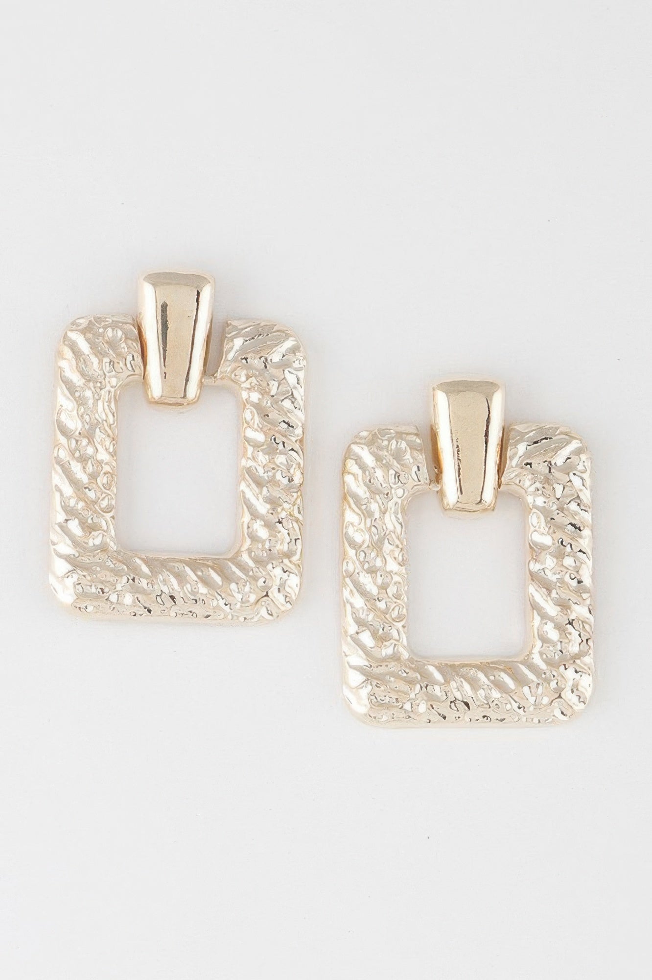 Hammered frame cut earrings in gold tone, square cutout with top bar