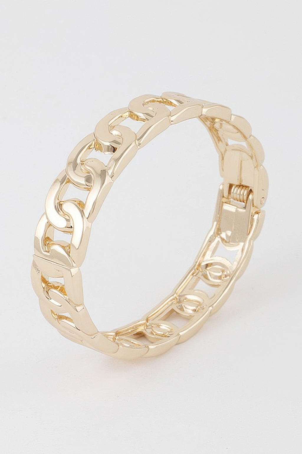 Gold curb chain cuff bracelet with geometric links and hinged clasp
