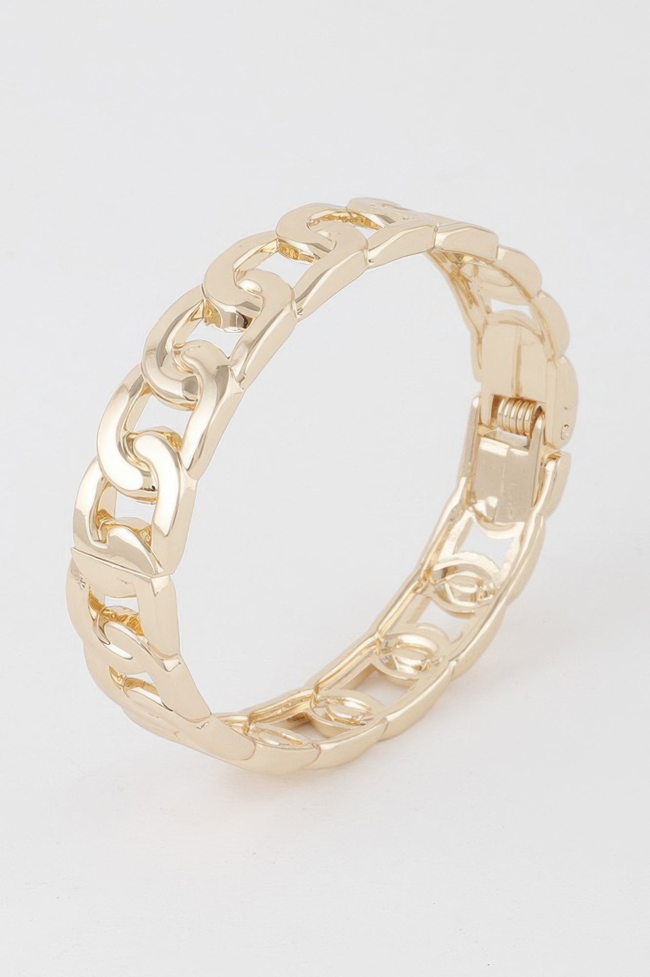 Gold curb chain cuff bracelet with geometric links and hinged clasp