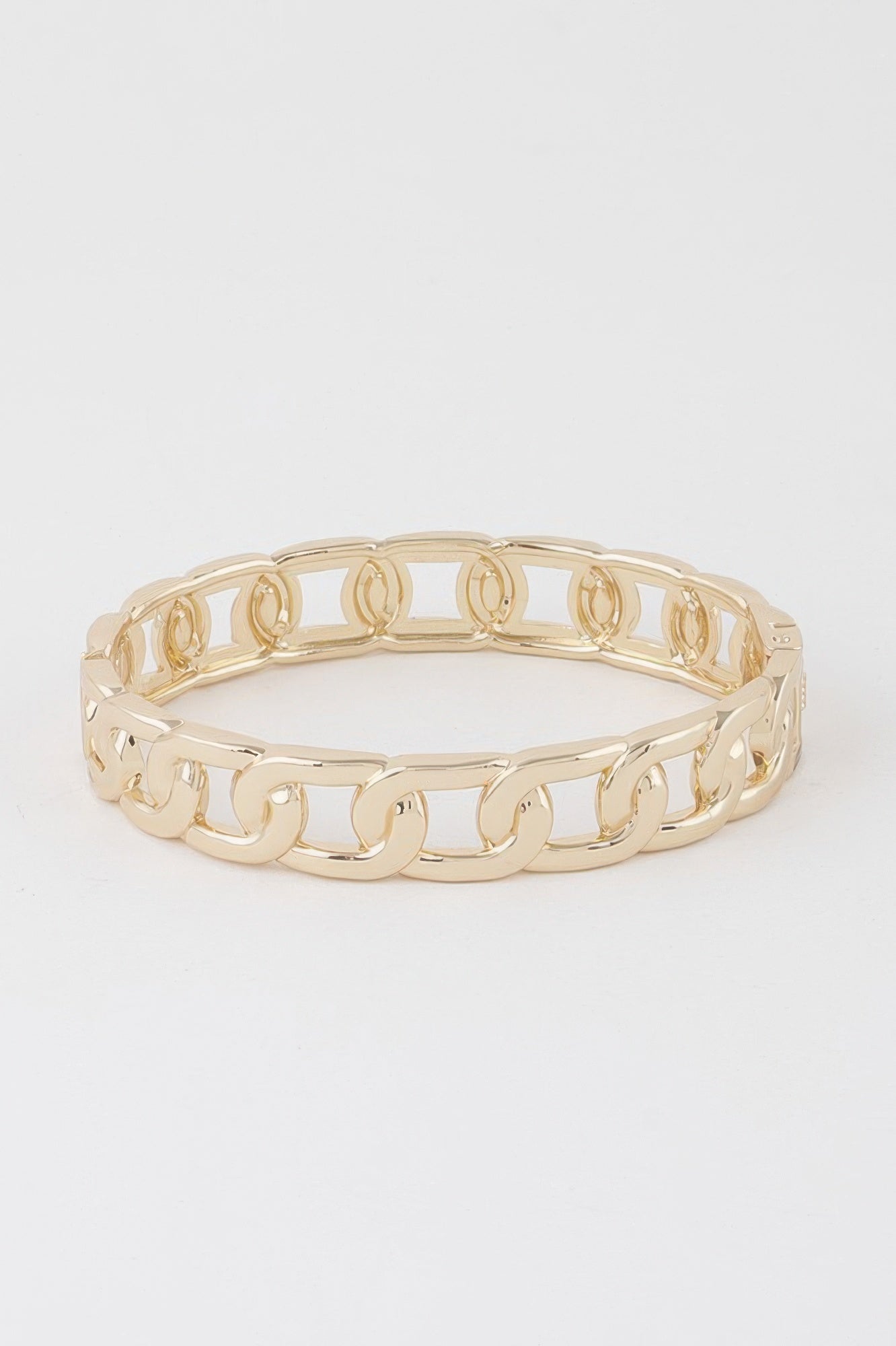Gold curb chain cuff bracelet, wide top view of interlocking links