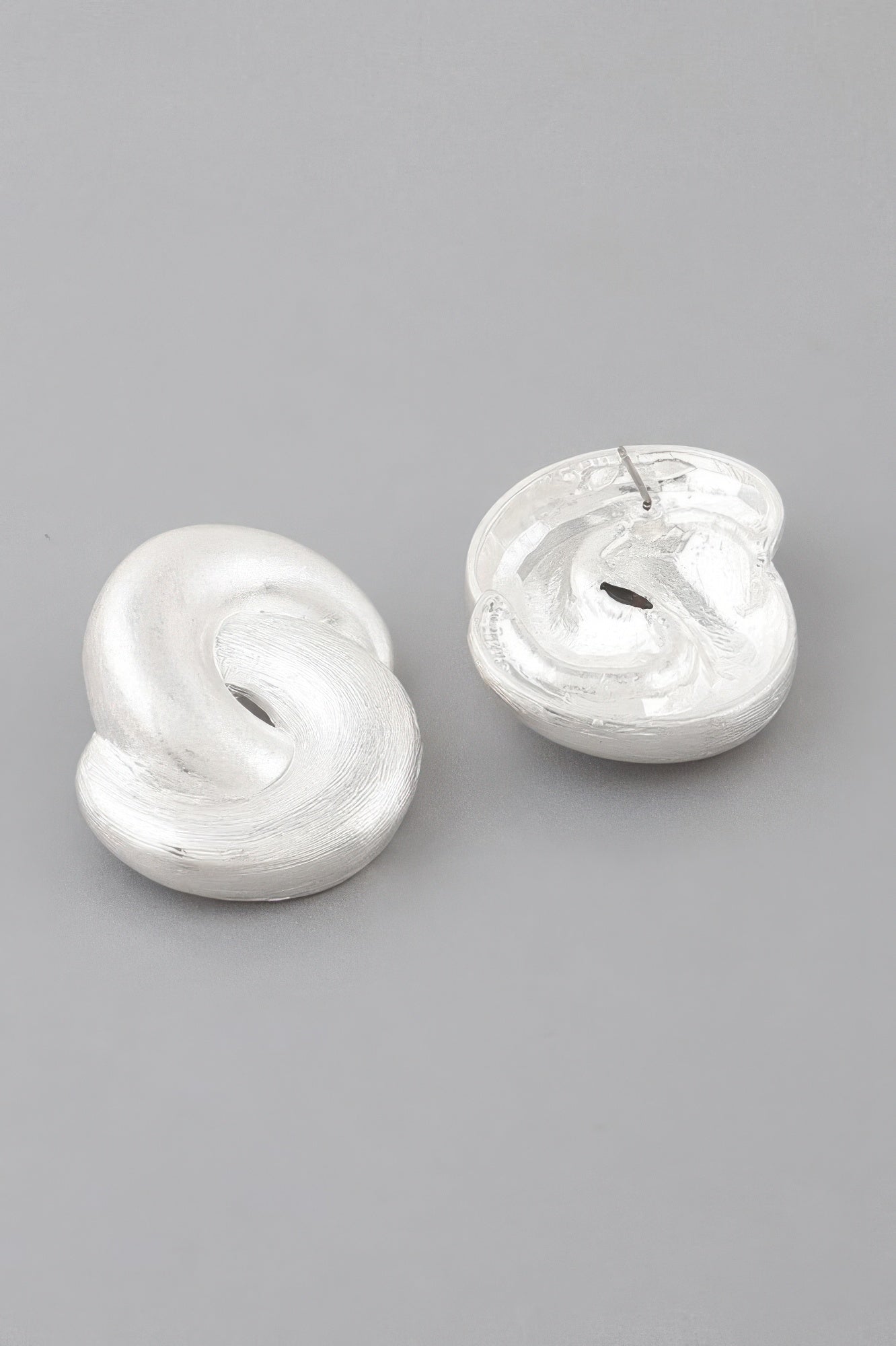 Bulky double-knot earrings, silver tone, heart-shaped knot design