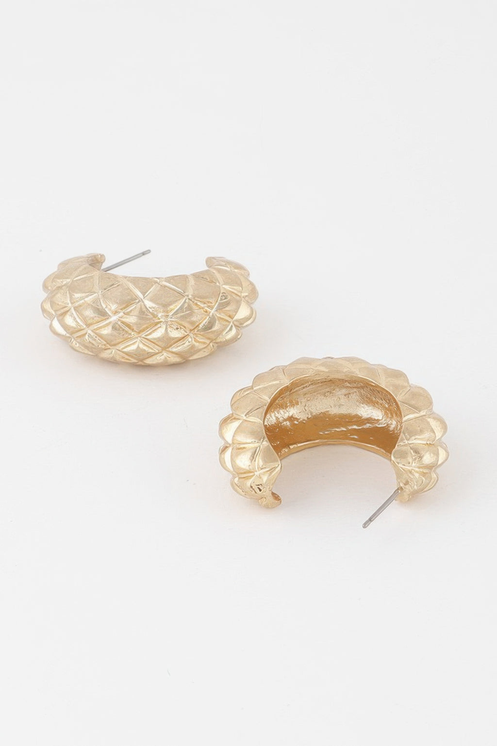 Gold quilted hoop earrings, open crescent style with textured diamond stitching