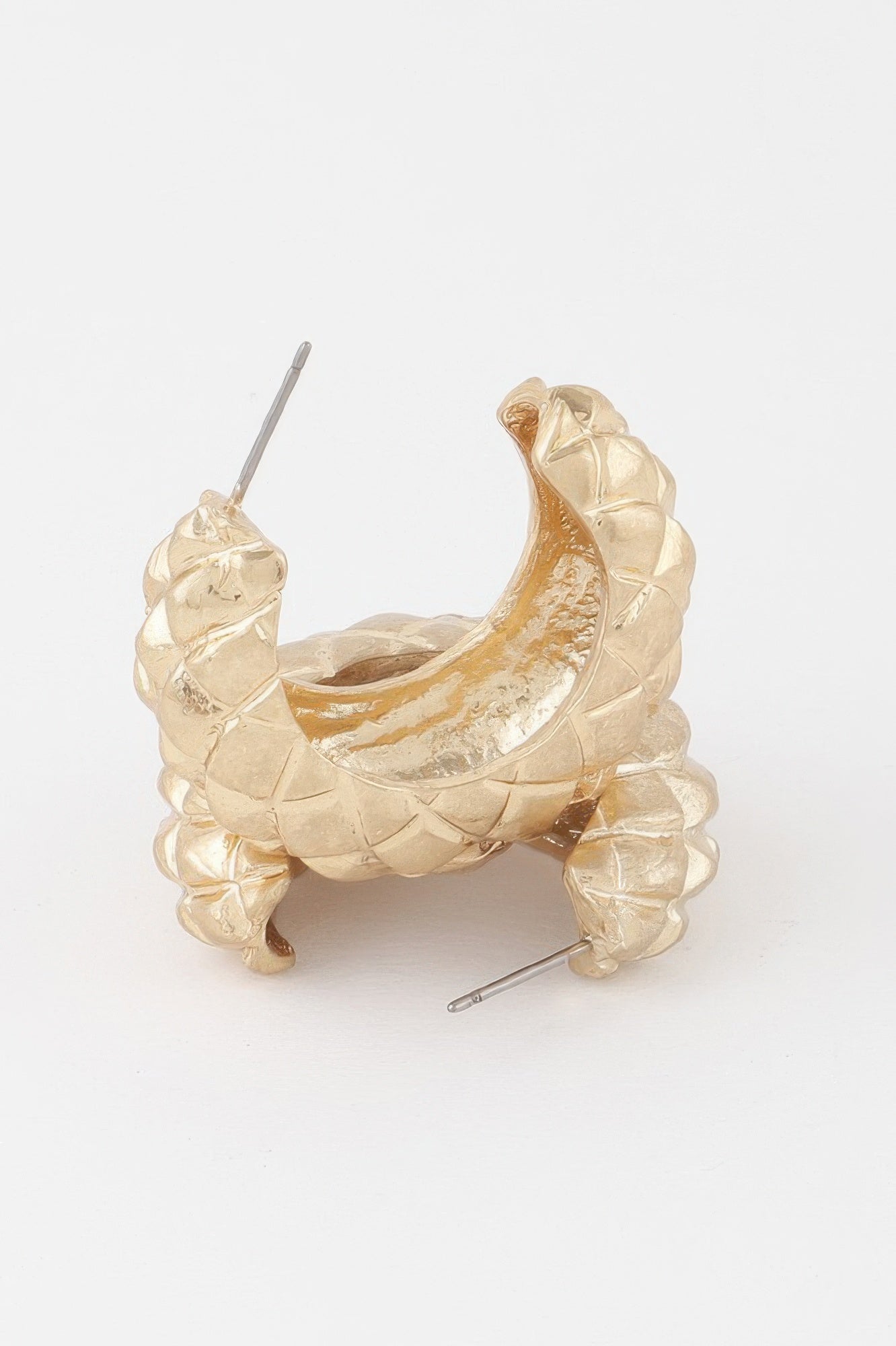 Quilted gold hoop earrings, side view showing clasp posts and glossy texture