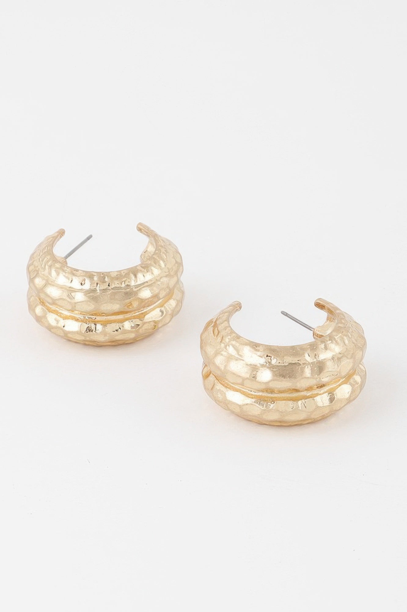 Double hammered gold hoop earrings, curved textured metal with post backs