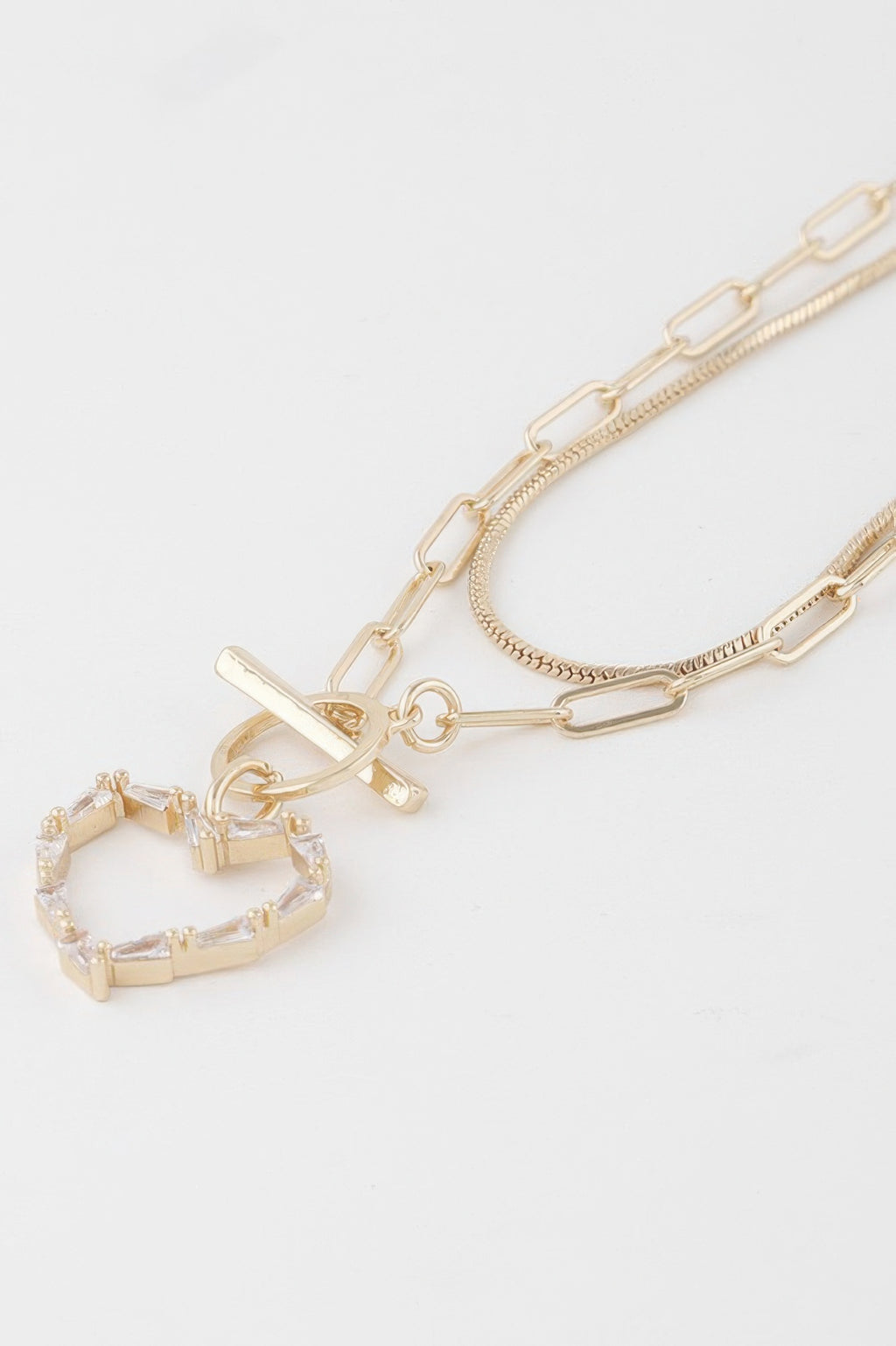 Gold clear heart pendant with toggle clasp and layered chain links