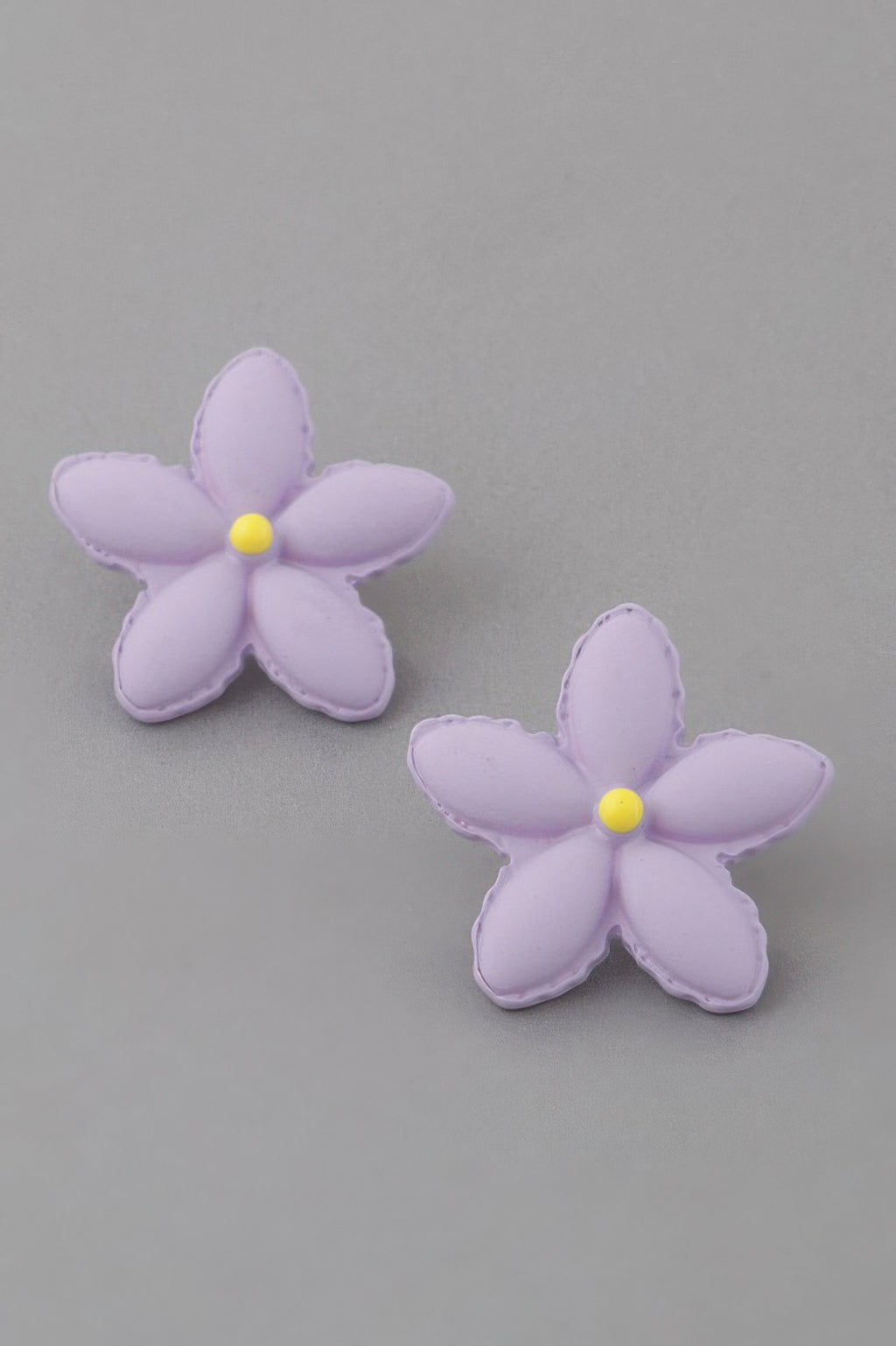 Lavender flower stud earrings with small yellow center, two flowers shown
