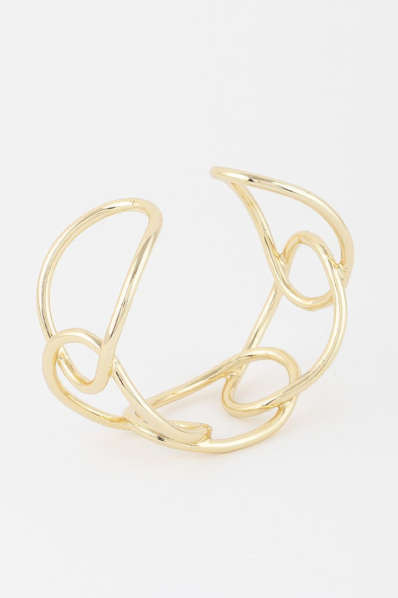 Gold wire cuff bracelet with abstract loop shapes and open oval links