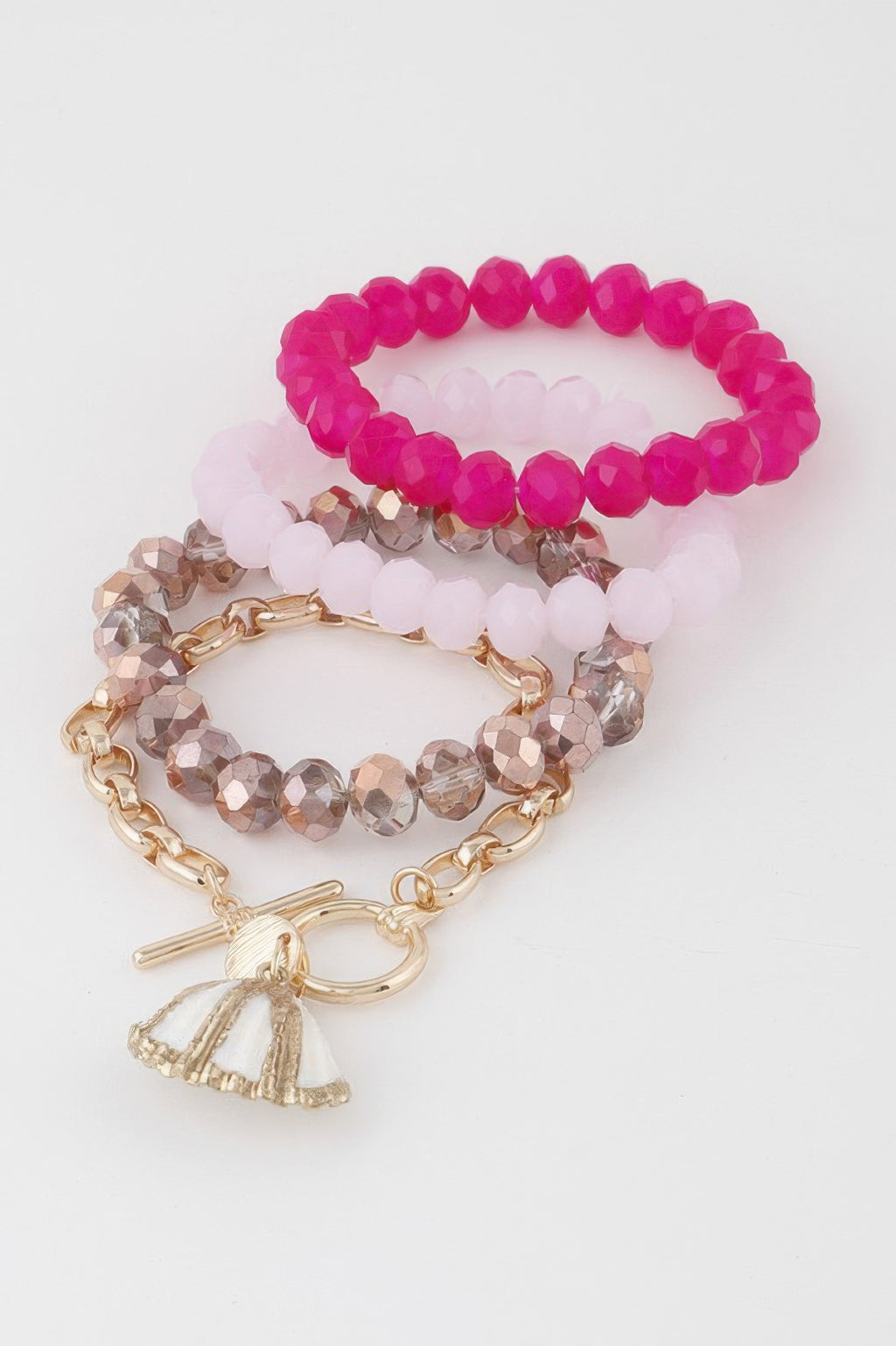 Multi Seashell Crystal Bracelet set with fuchsia bead strands and gold shell tassel charm