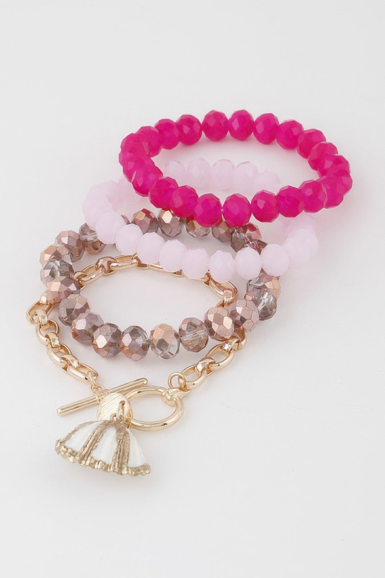 Multi Seashell Crystal Bracelet set with fuchsia bead strands and gold shell tassel charm