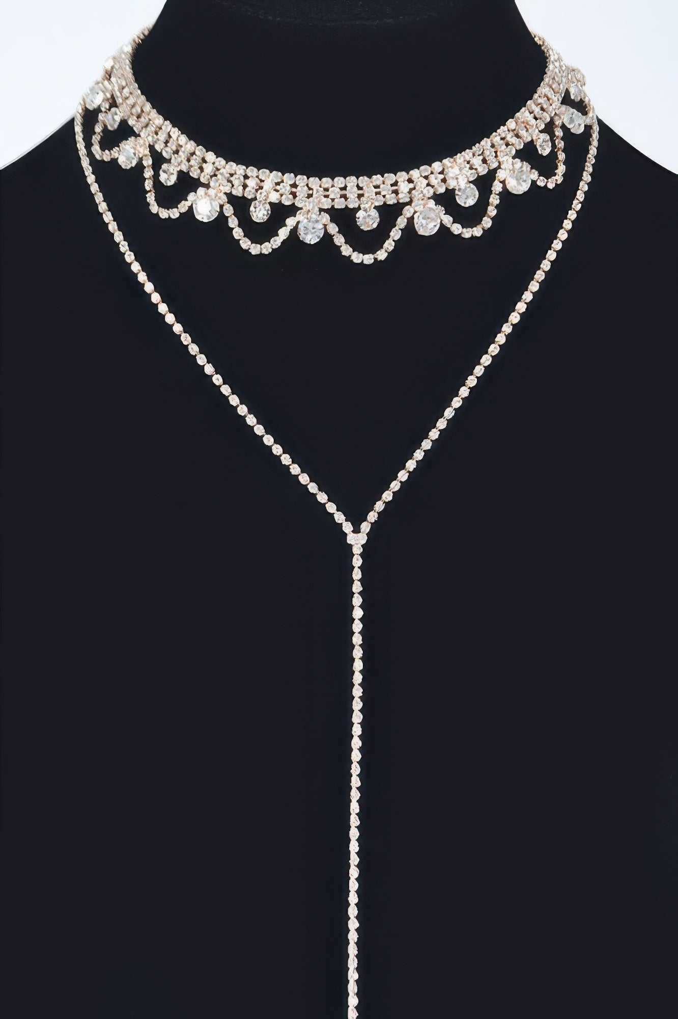 Rhinestone necklace with scalloped choker and long pendant drop, silver tone