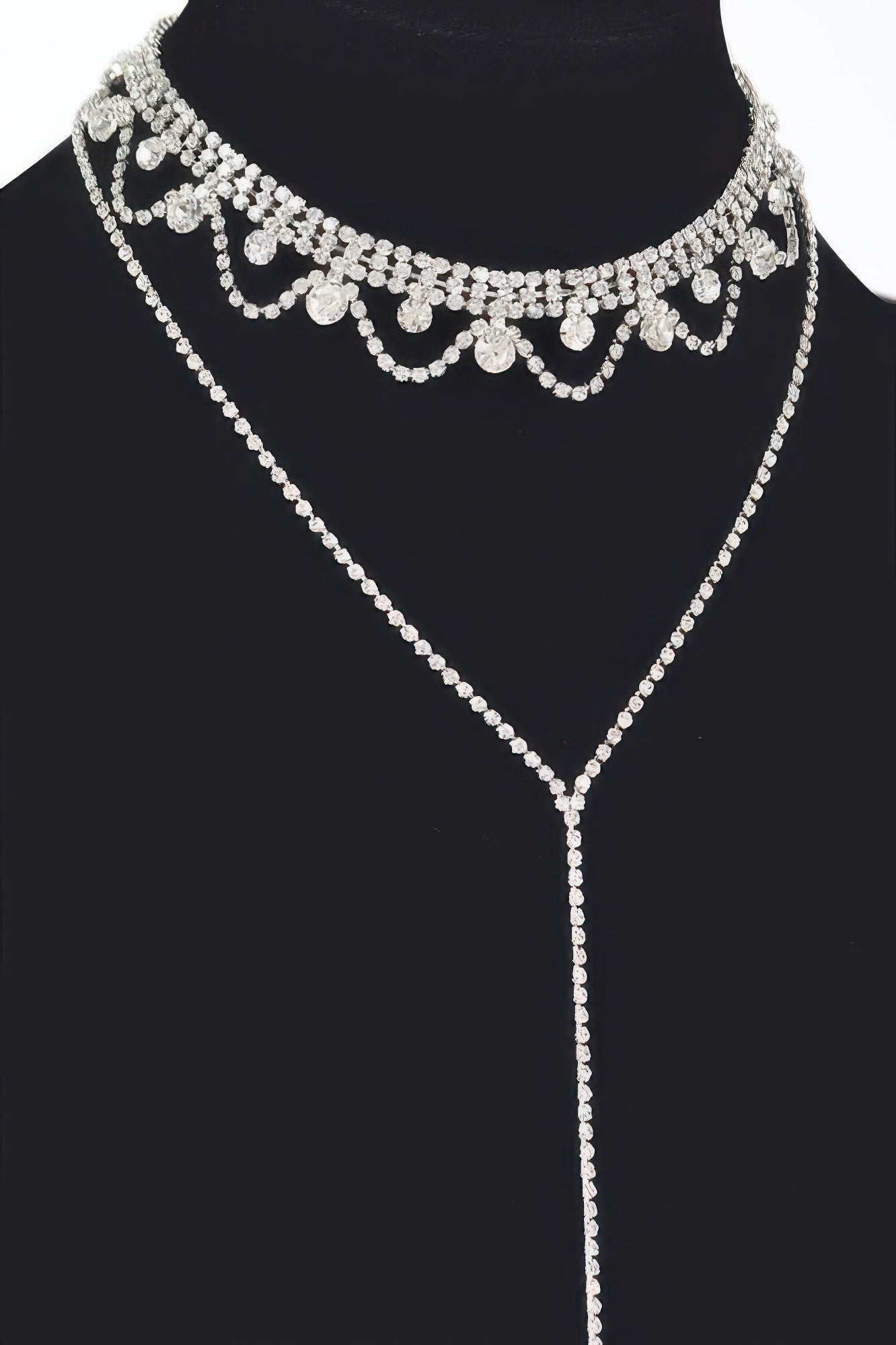 Rhinestone necklace detail: scalloped choker with dangling stones and long pendant, silver tone