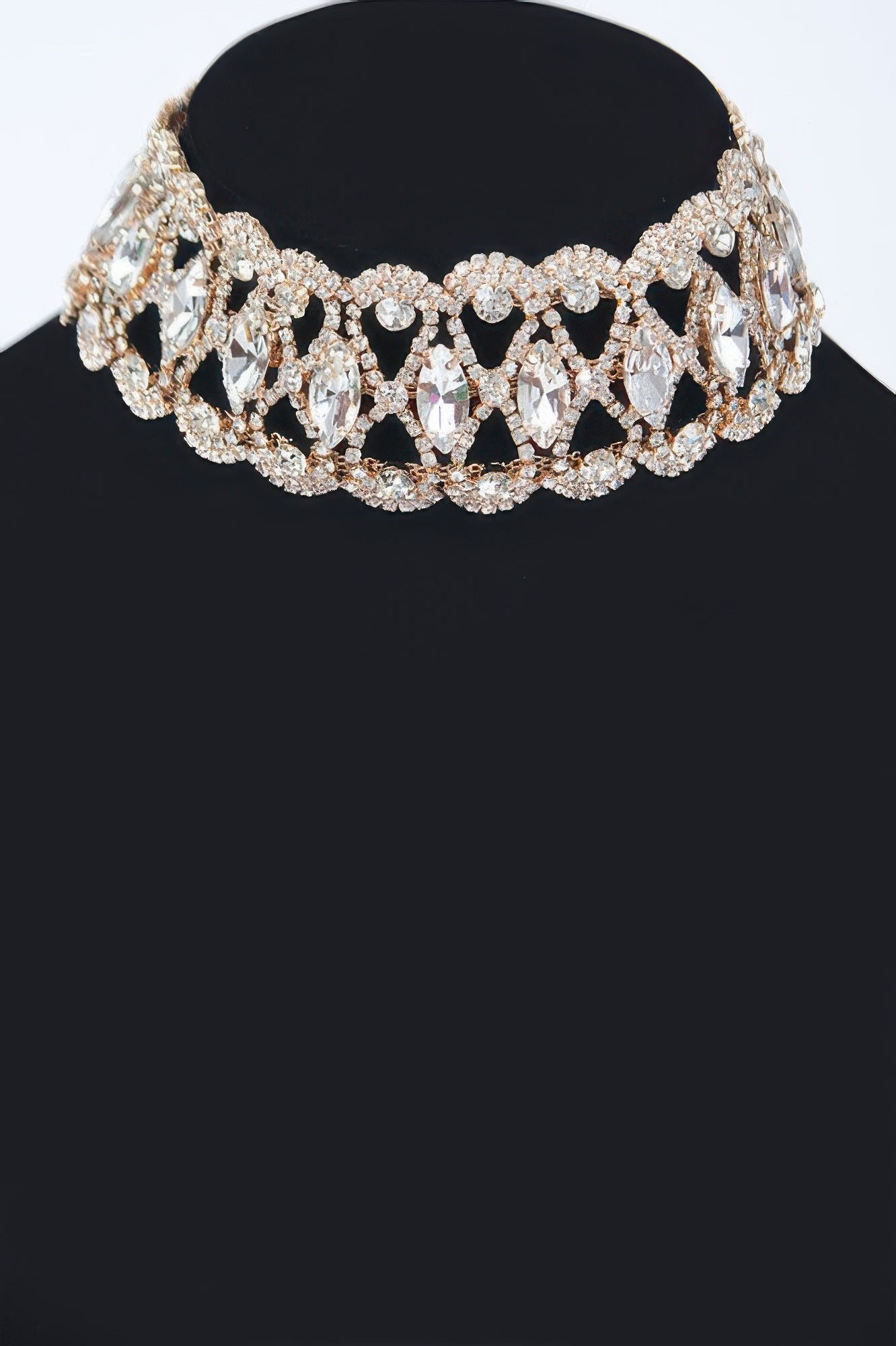 Rhinestone choker necklace with oval and teardrop stones, sparkling silver tone.