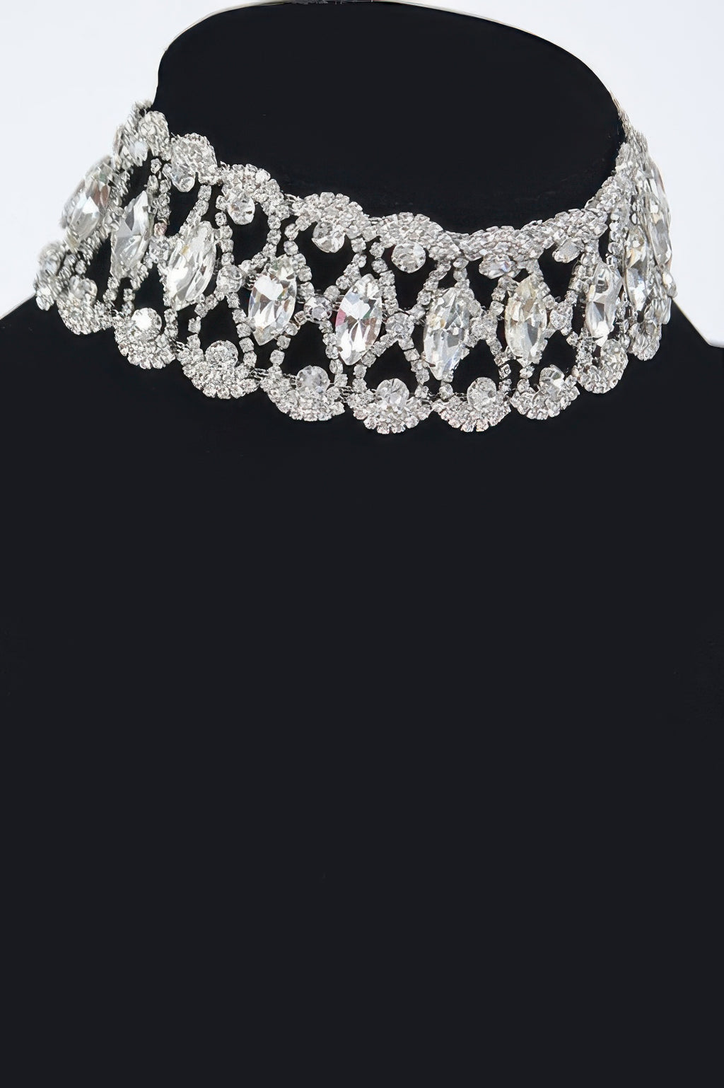 Silver rhinestone choker with clustered marquise stones and layered sparkles.