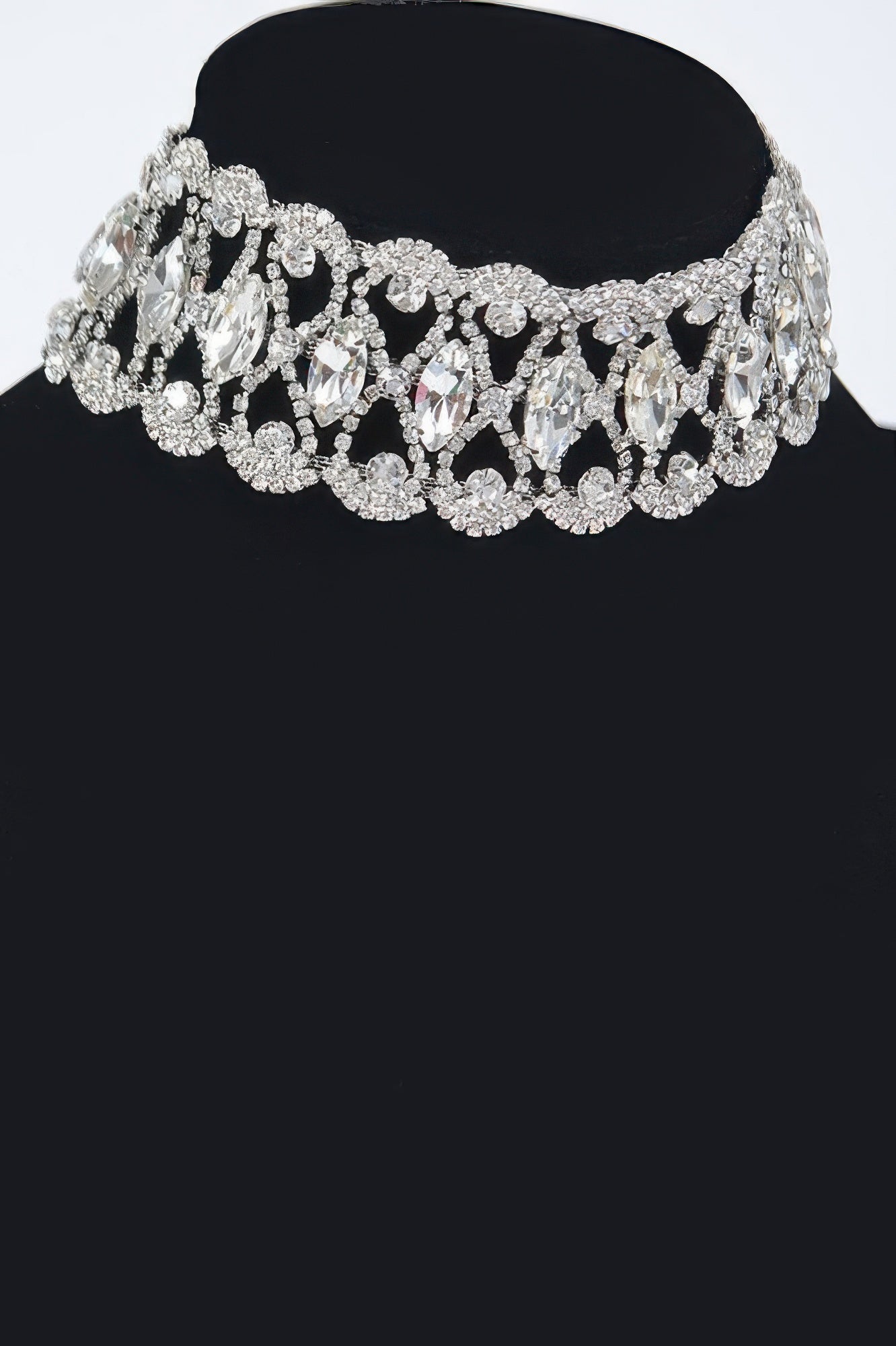 Silver rhinestone choker with clustered marquise stones and layered sparkles.