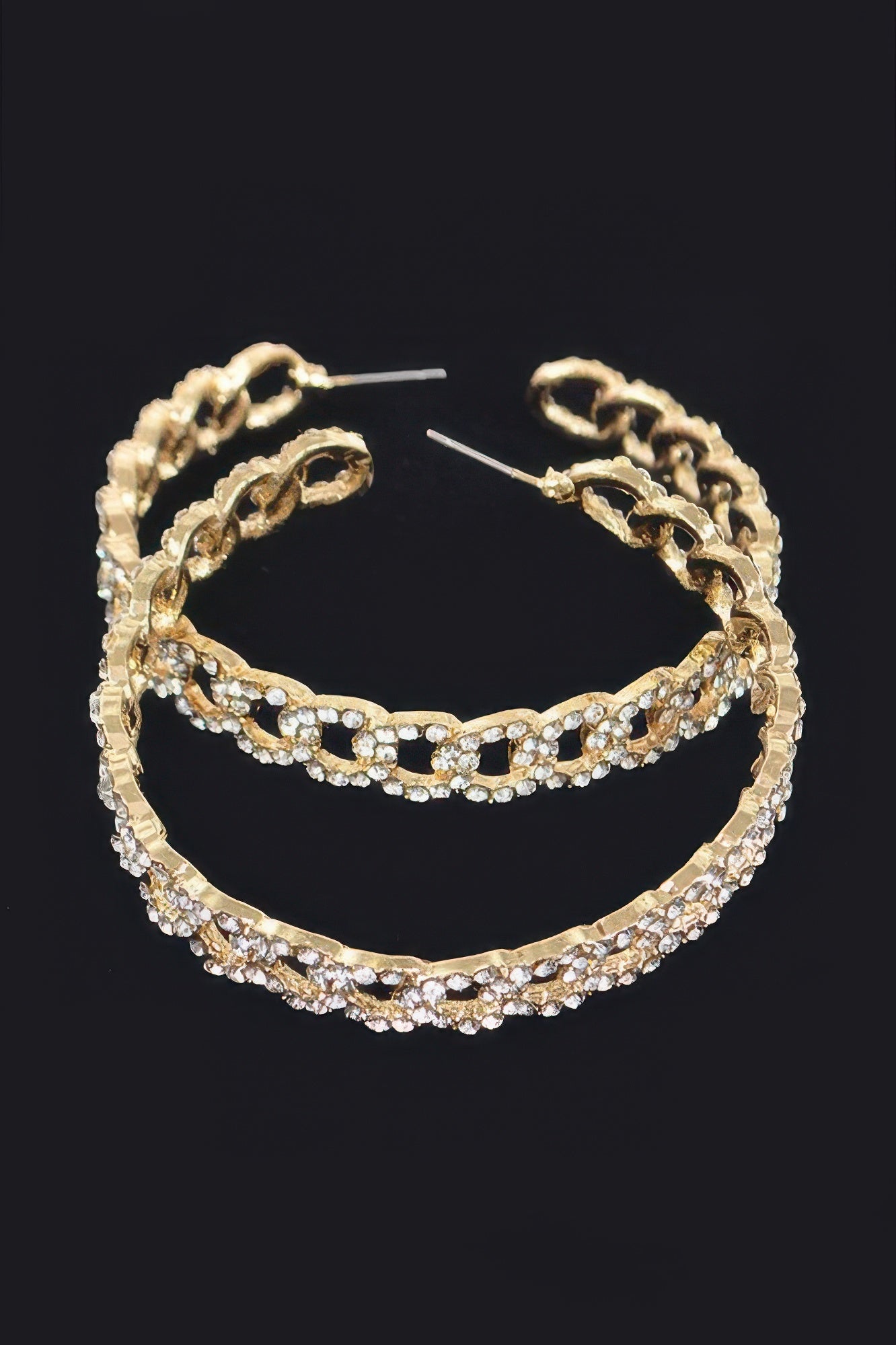 Gold hoop earrings with linked oval frame and multicolor rhinestone row