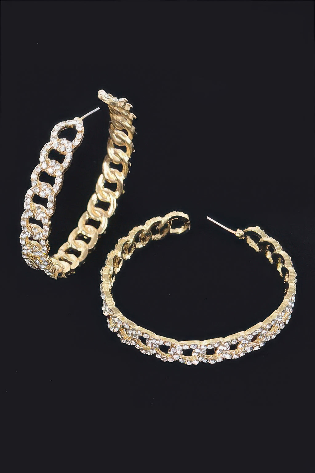 Gold-toned hoop earrings, side view with linked band and clear/crystal sparkle