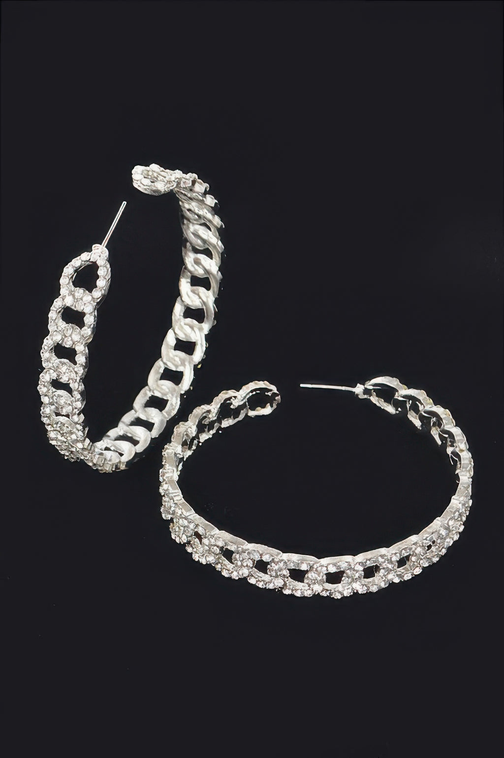 Silver hoop earrings, side angle showing thick linked chain and rhinestone row