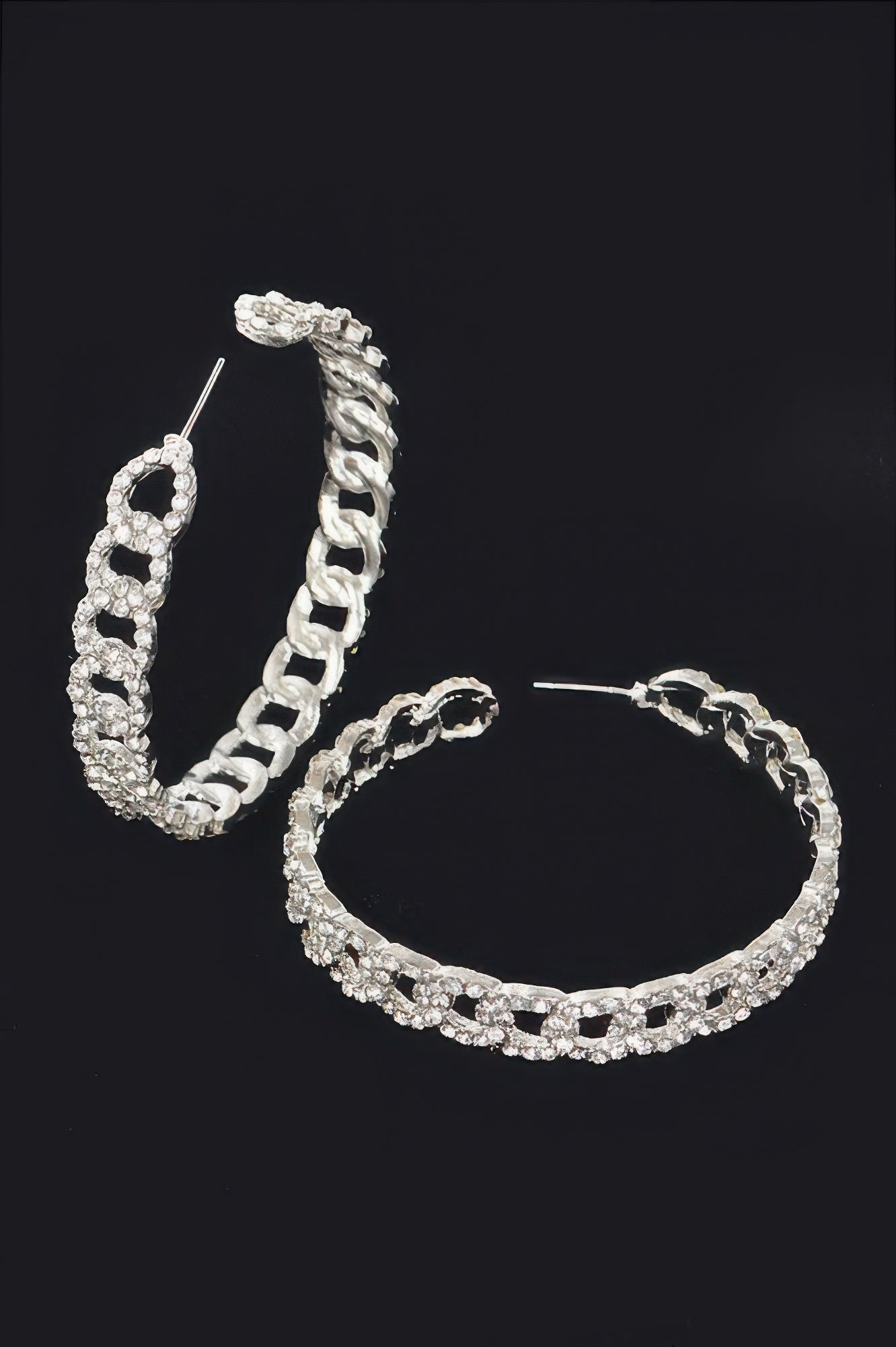 Silver hoop earrings, side angle showing thick linked chain and rhinestone row