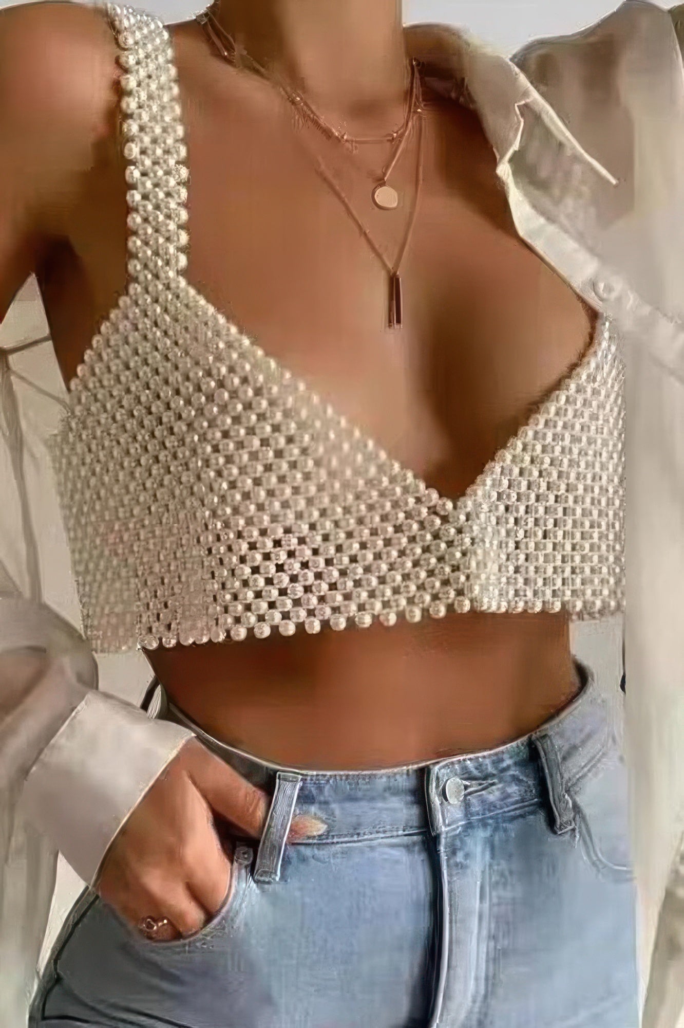 Tigbul's Faux Pearl Bralette on model: cream beaded V-neck bralette, underbust band