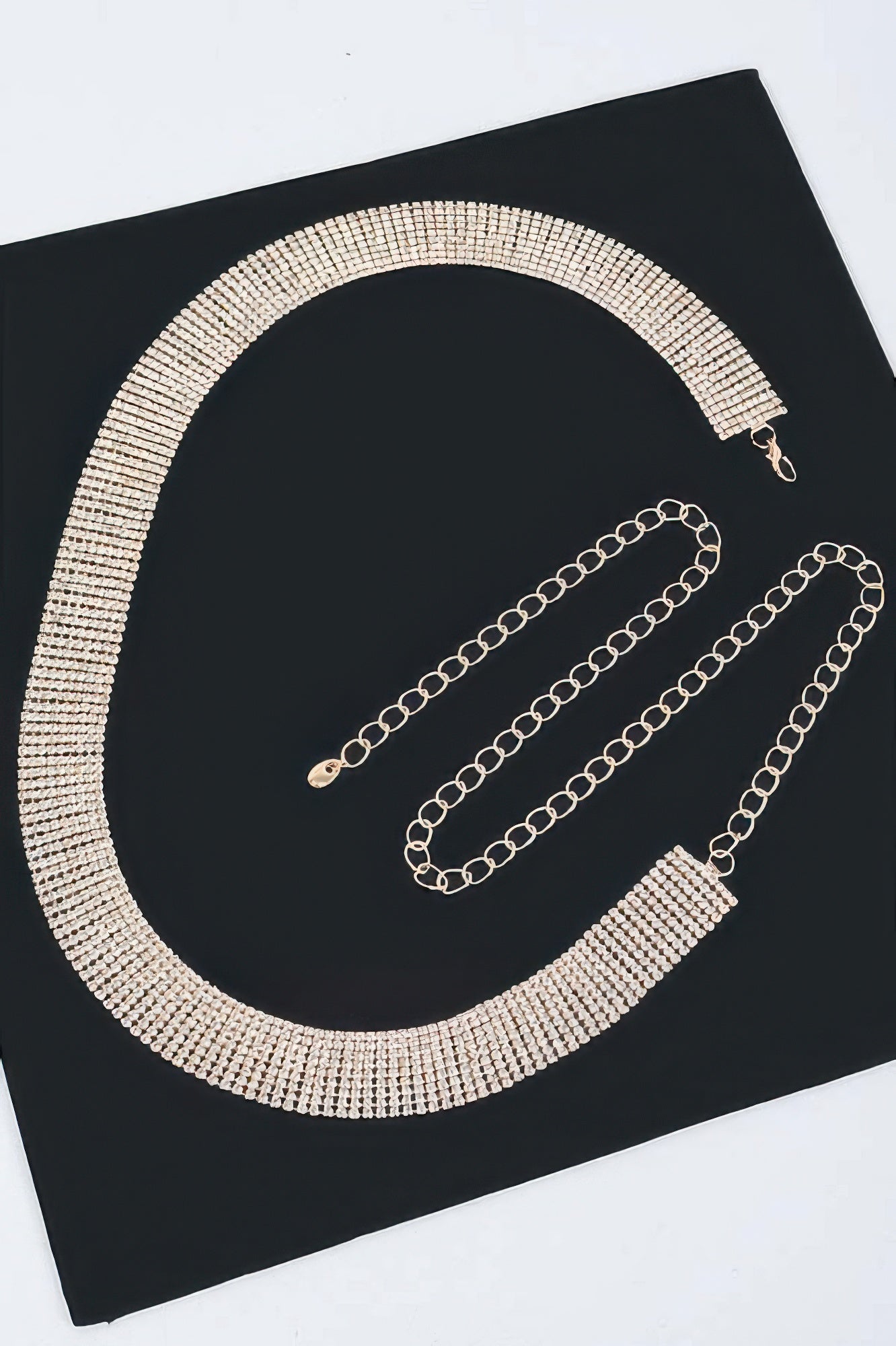 Silver rhinestone belt with chain tassels and end clasp detail