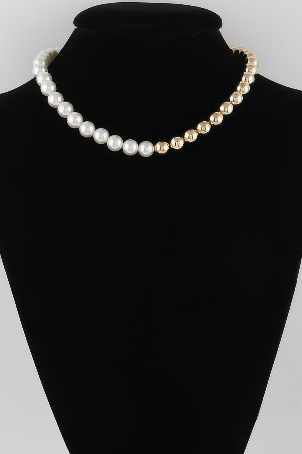 Two-toned beaded necklace with cream and gold pearl-style beads